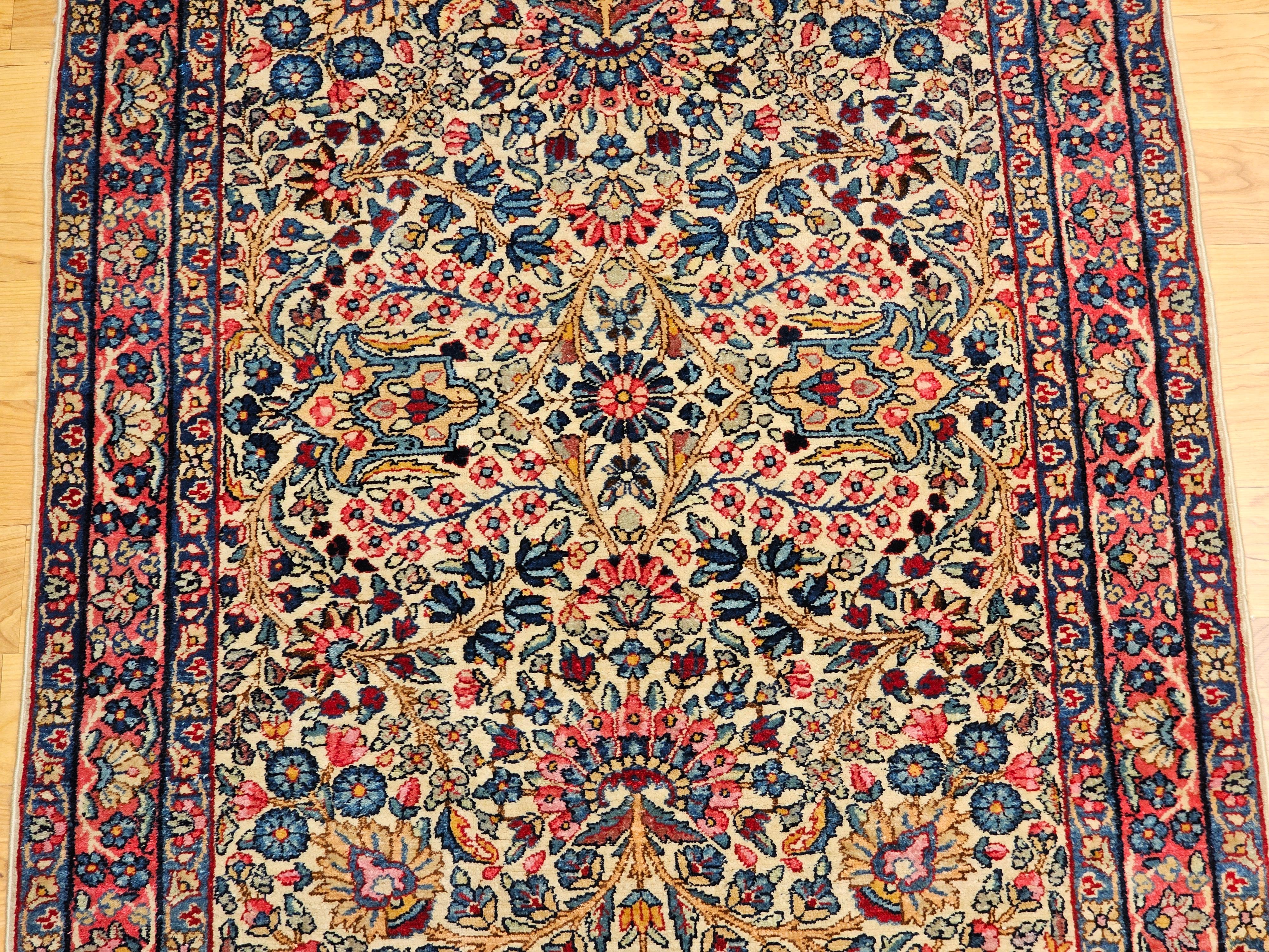 Vintage Persian Kerman Lavar Area Rug in Ivory, Blue, Pink, Red, Yellow In Good Condition For Sale In Barrington, IL