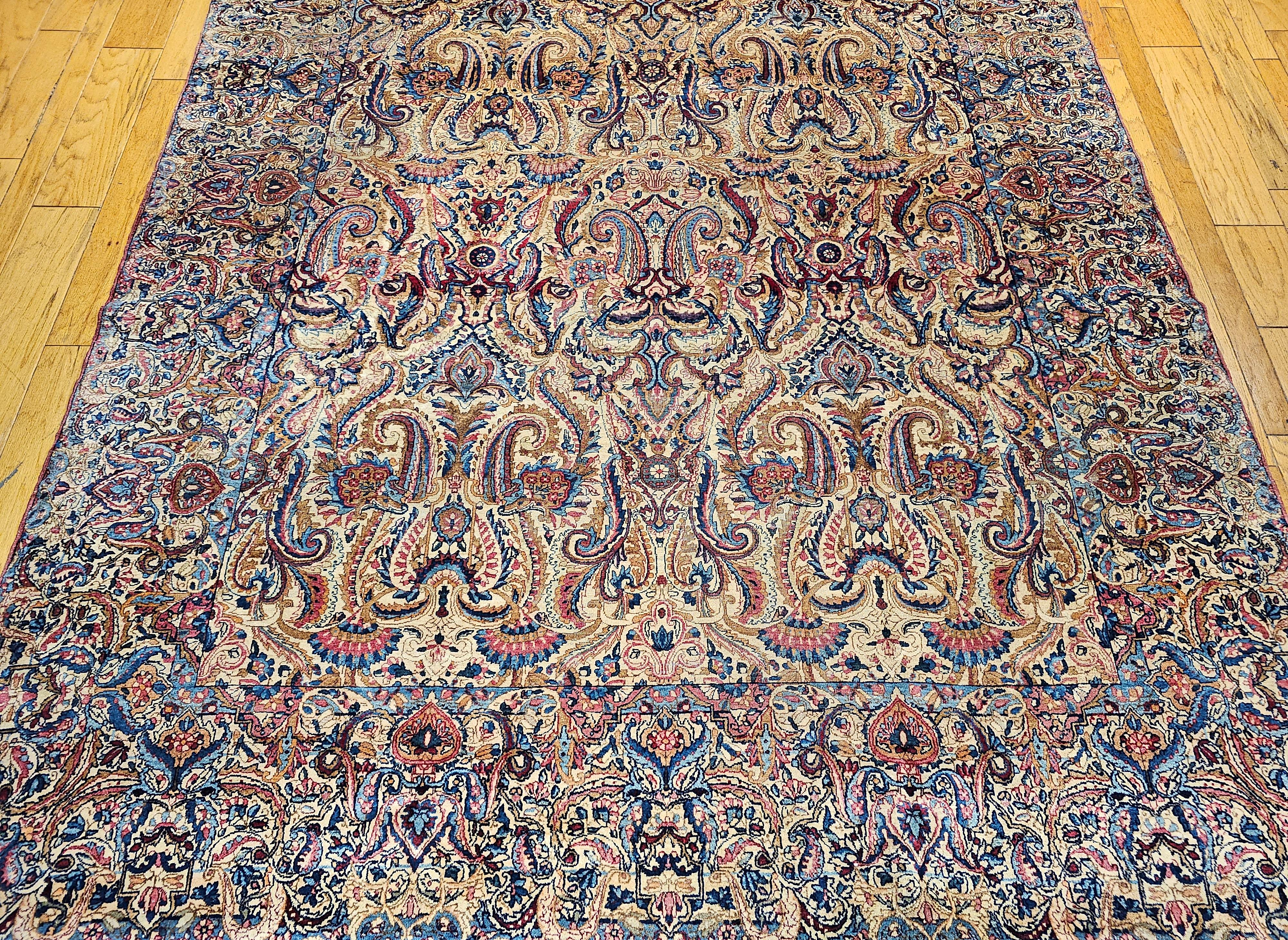 Hand-Knotted Vintage Persian Kerman Lavar in All-Over Paisley Pattern in Ivory, Blue, Red For Sale