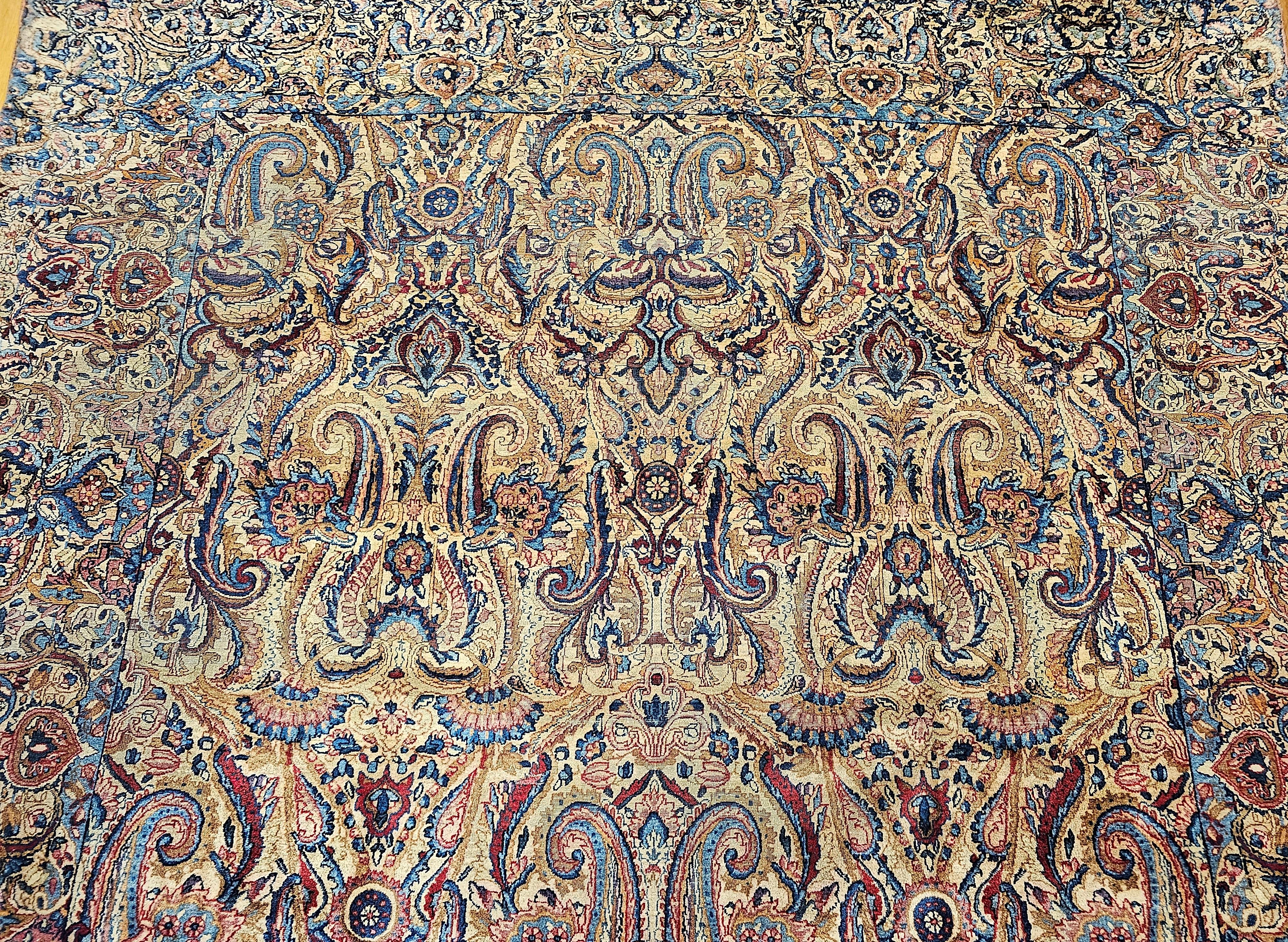 20th Century Vintage Persian Kerman Lavar in All-Over Paisley Pattern in Ivory, Blue, Red For Sale