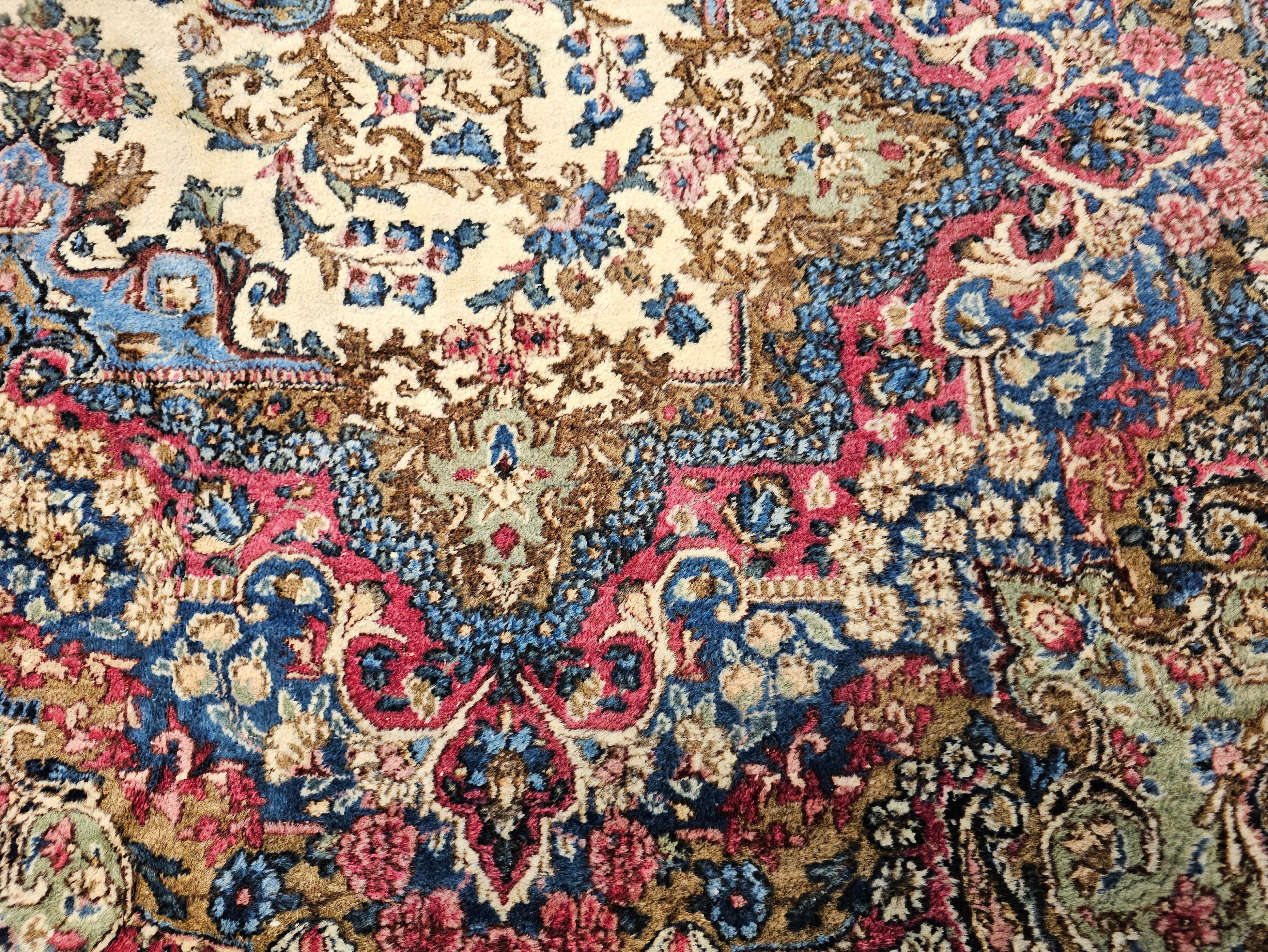 Wool Vintage Persian Kerman Lavar in Allover Floral Pattern in Ivory, Red, Pink, Blue For Sale