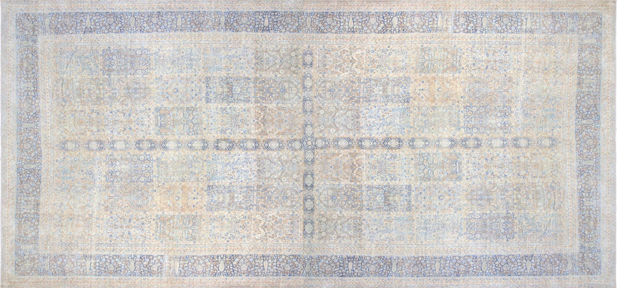 This Vintage Persian Kerman rug, measuring 12'5