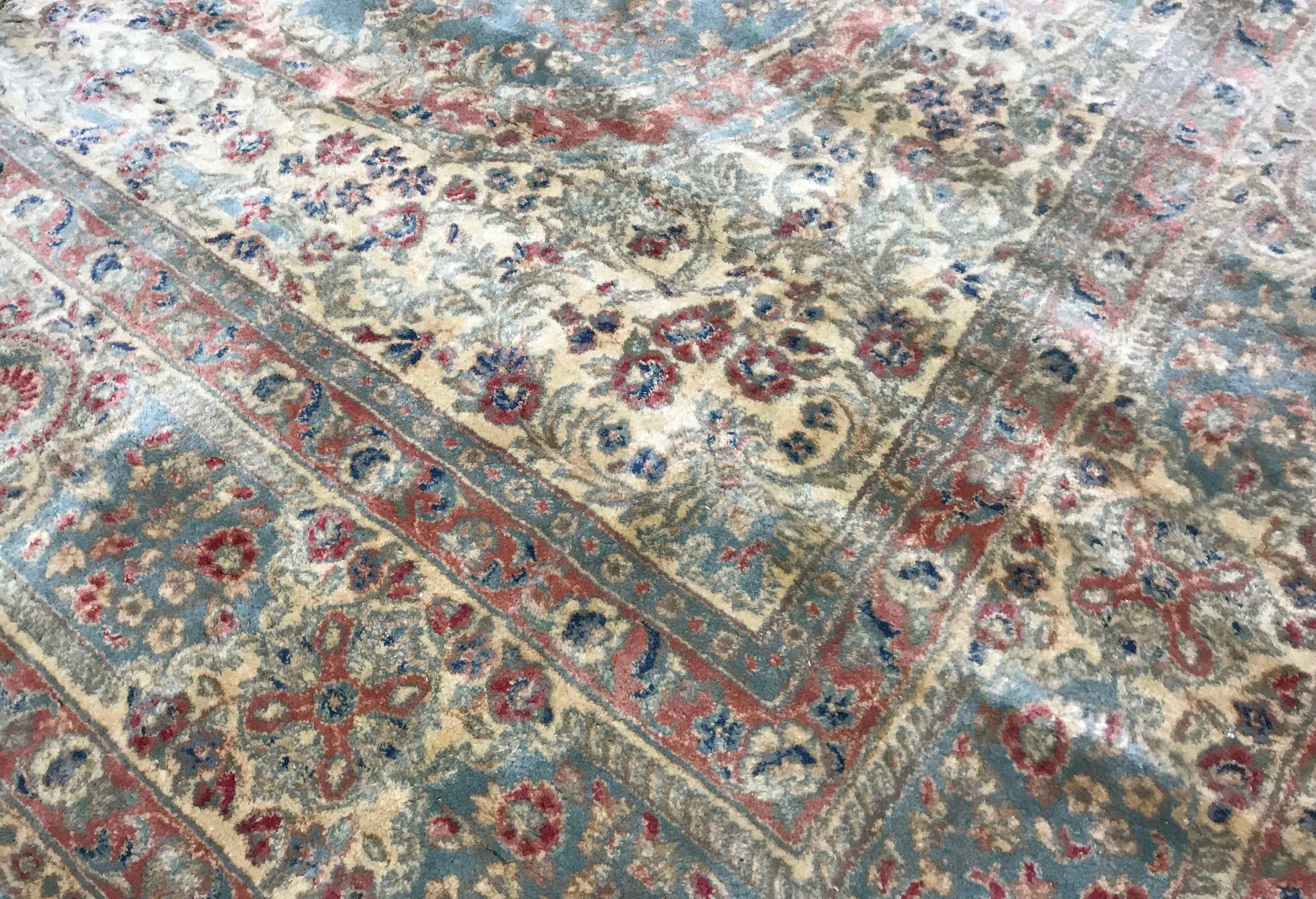 Vintage Persian Kerman rug, circa 1940. The soft blue ground of this Kerman rug is the setting for wonderful floral designs both in the central medallion the frame of the main field and the borders to create this soft and relaxing rug. Size: 10'11 x