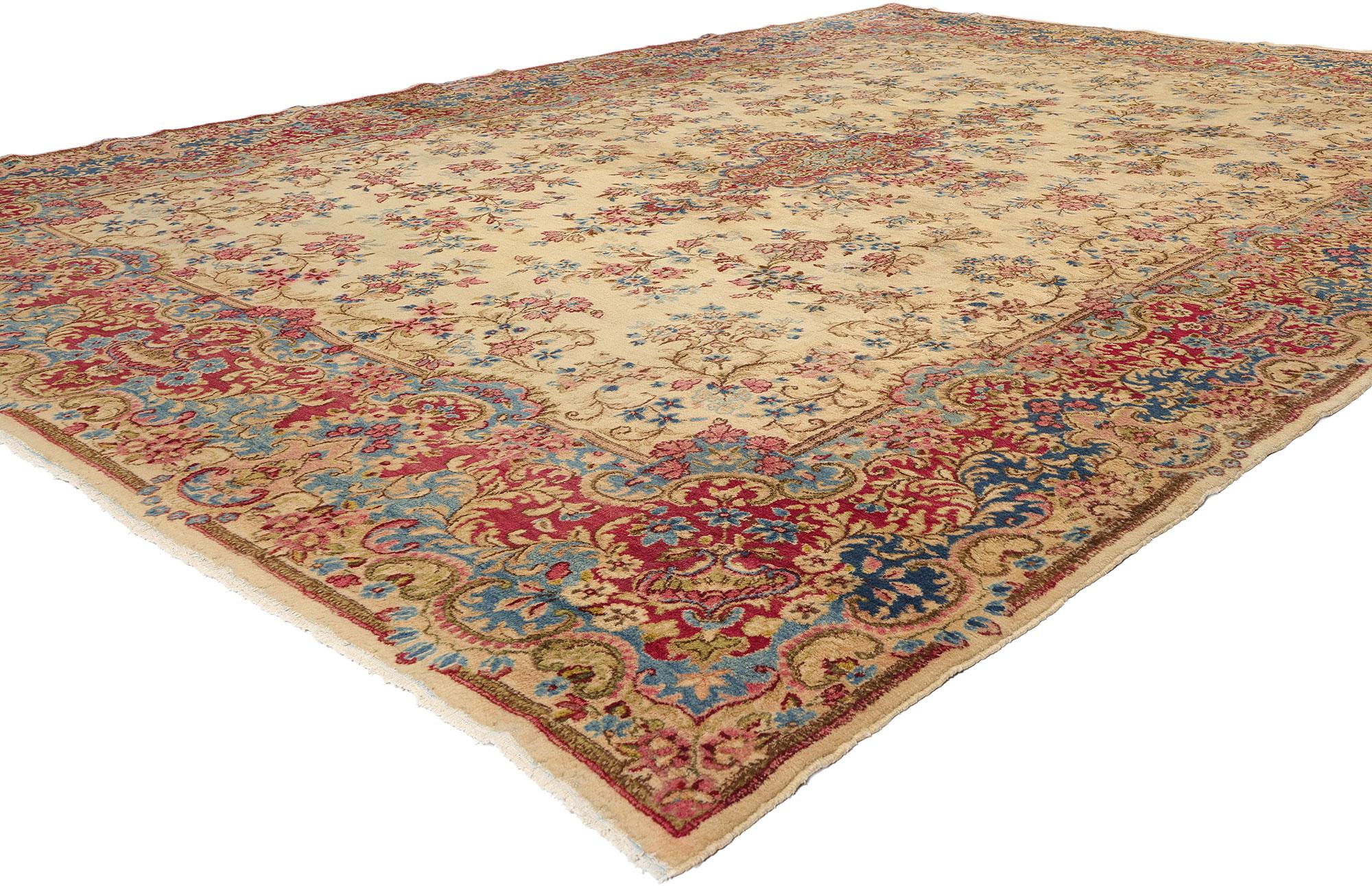 74920 Vintage Persian Kerman Rug, 09'09 x 13'04. The legacy of Kerman rugs unfolds from the captivating heart of south-central Iran, where the city of Kerman weaves tales of timeless artistry. This vibrant center of weaving bears witness to