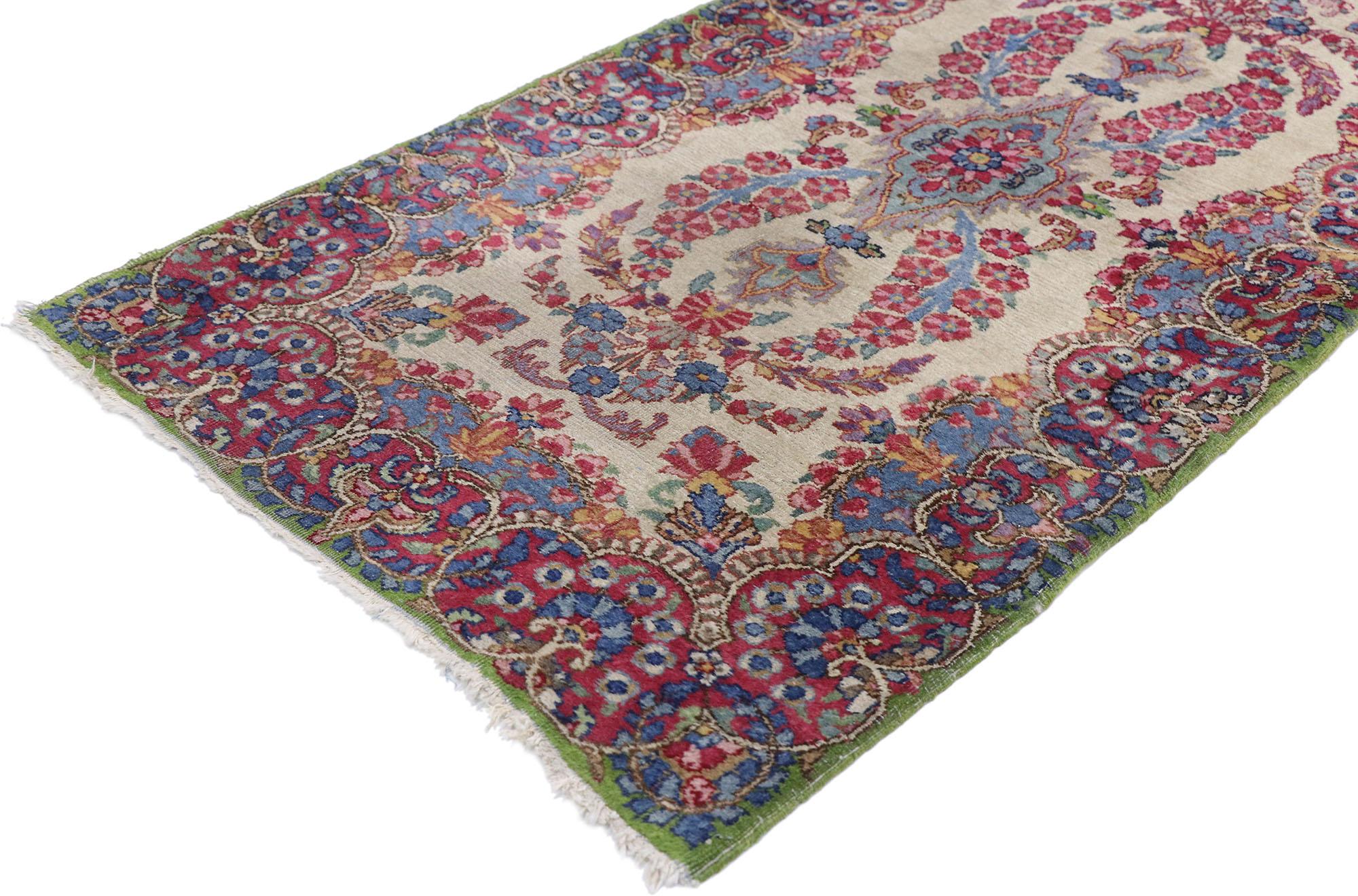 77655 Vintage Persian Kerman rug with French Victorian style. Sophisticated and refined with a French Victorian style, this hand knotted wool vintage Persian Kerman rug charms with ease. The abrashed sandy beige field features colorful floral
