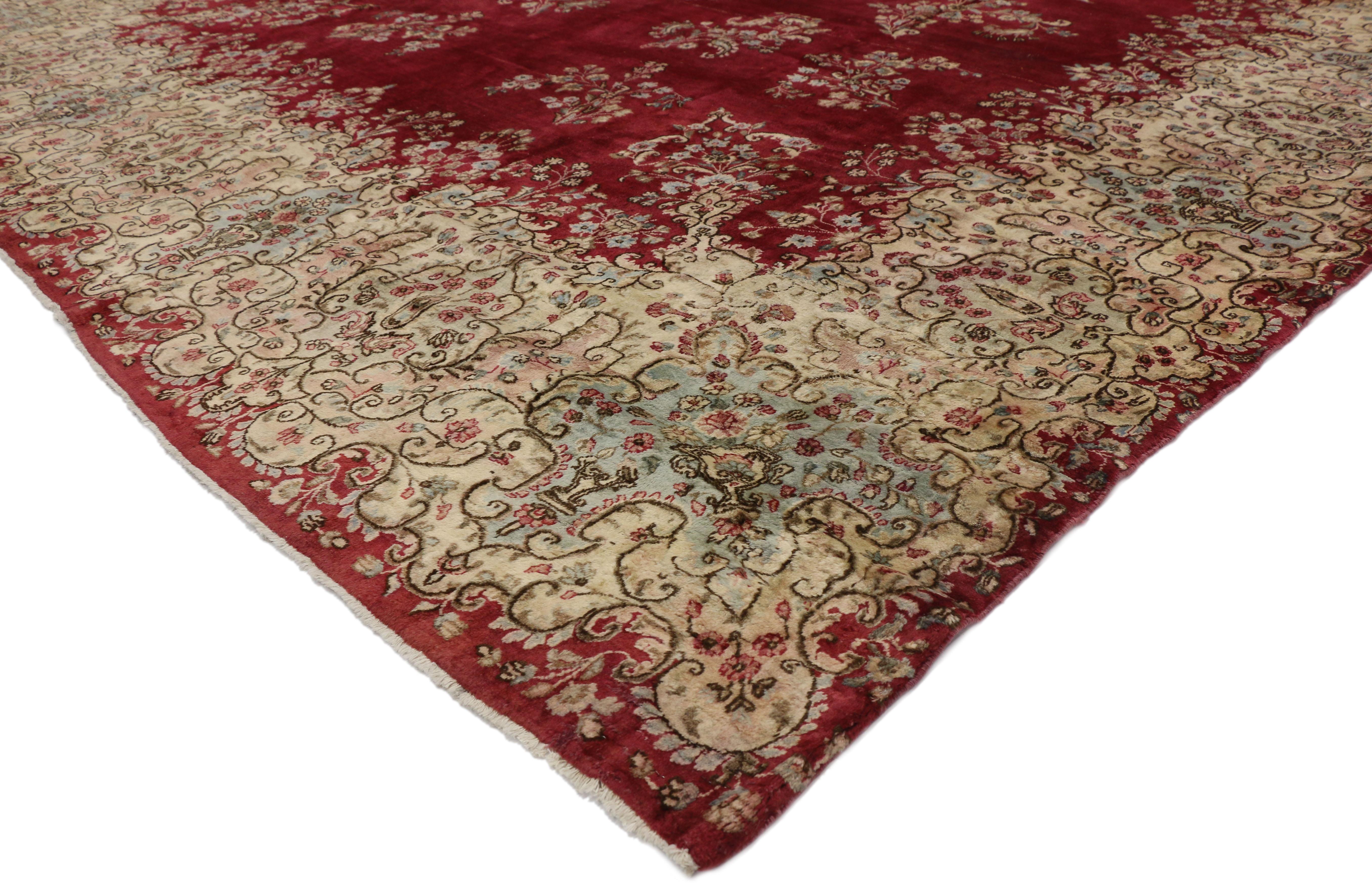76516, vintage Persian Kerman rug with Victorian style. Opulence and grace meld together seamlessly in this vintage Persian Kerman rug with Victorian style. The most striking element is the bright center field in a lustrous ruby red. Meanwhile a