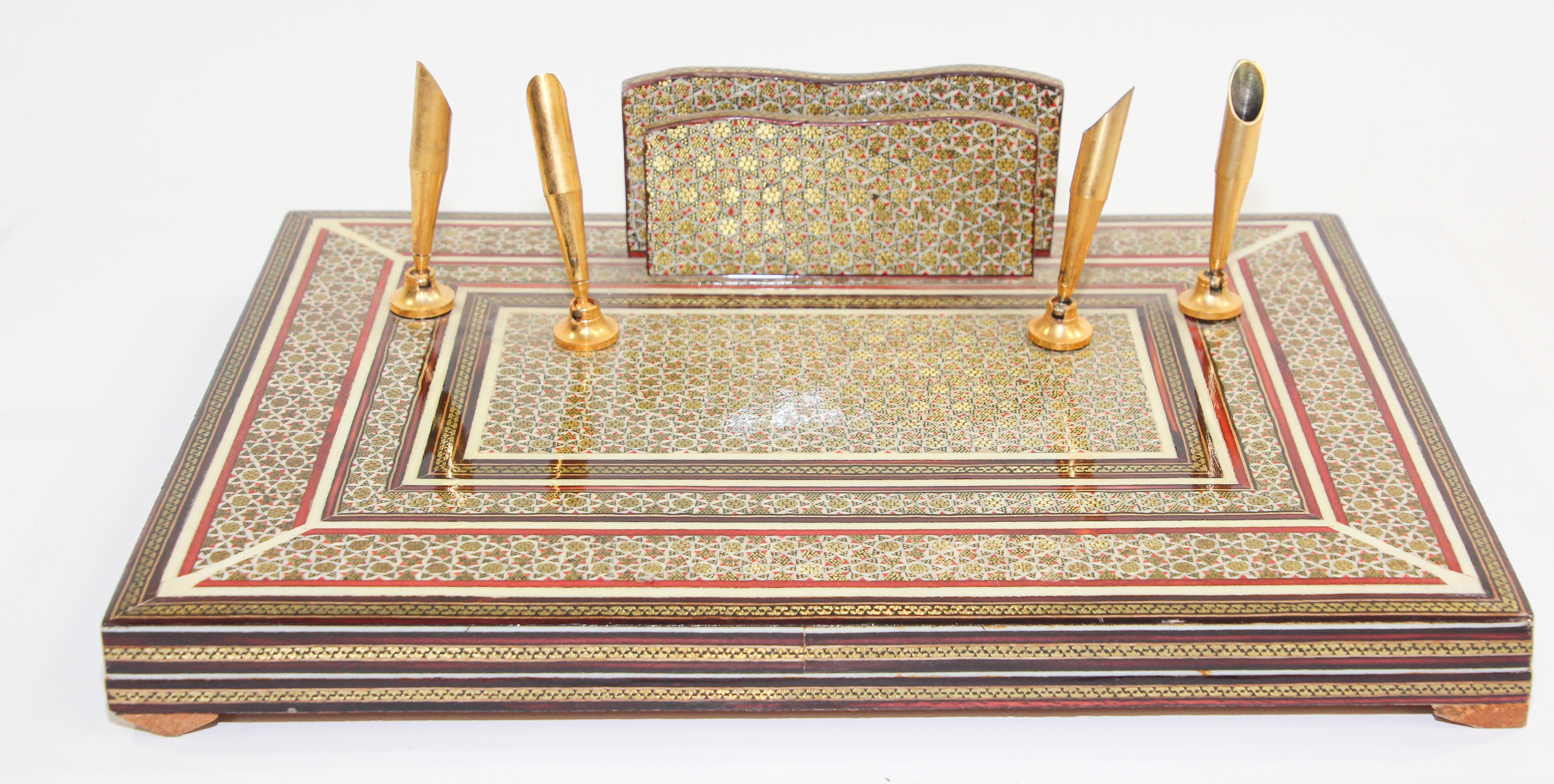 This is a vintage Persian style letter and penholder with 4 brass tips pen holder.
The wooden base is khatam inlaid micro mosaic.
It is solid and in very good condition for age. 
Nice Moorish decorative item on desk top.
Khatam is a Persian