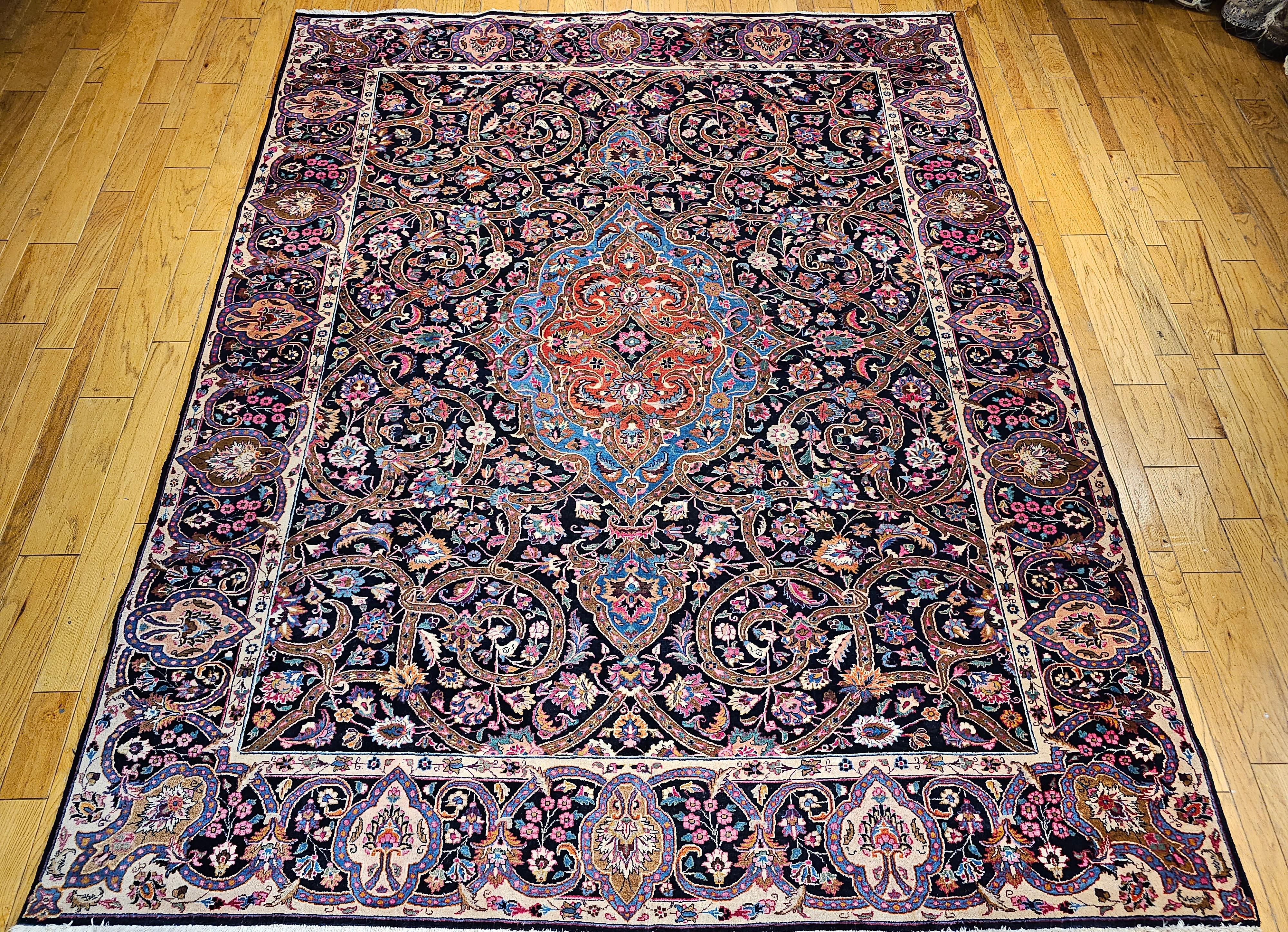 Vintage Persian Khorassan room size hand-knotted rug in a floral pattern circa the 2nd quarter of the 1900s. The rug has a unique 