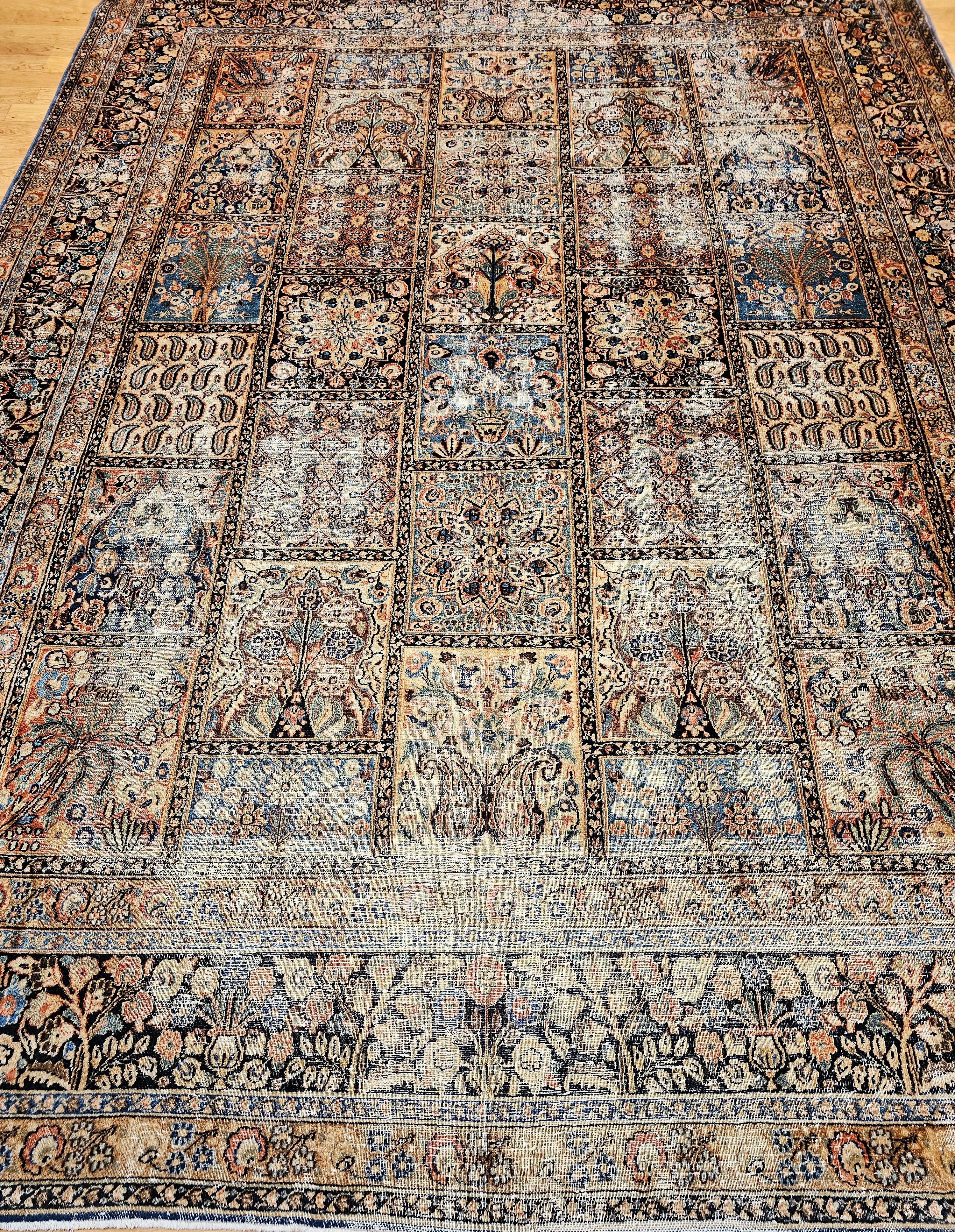  Magnificent late 19th century/early 20th century Persian Khorassan rug in an allover panel design in green, royal blue, burgundy, ivory, brown and camel colors.  The unique offset panel pattern adds to the charm of this beautiful rug.  The design