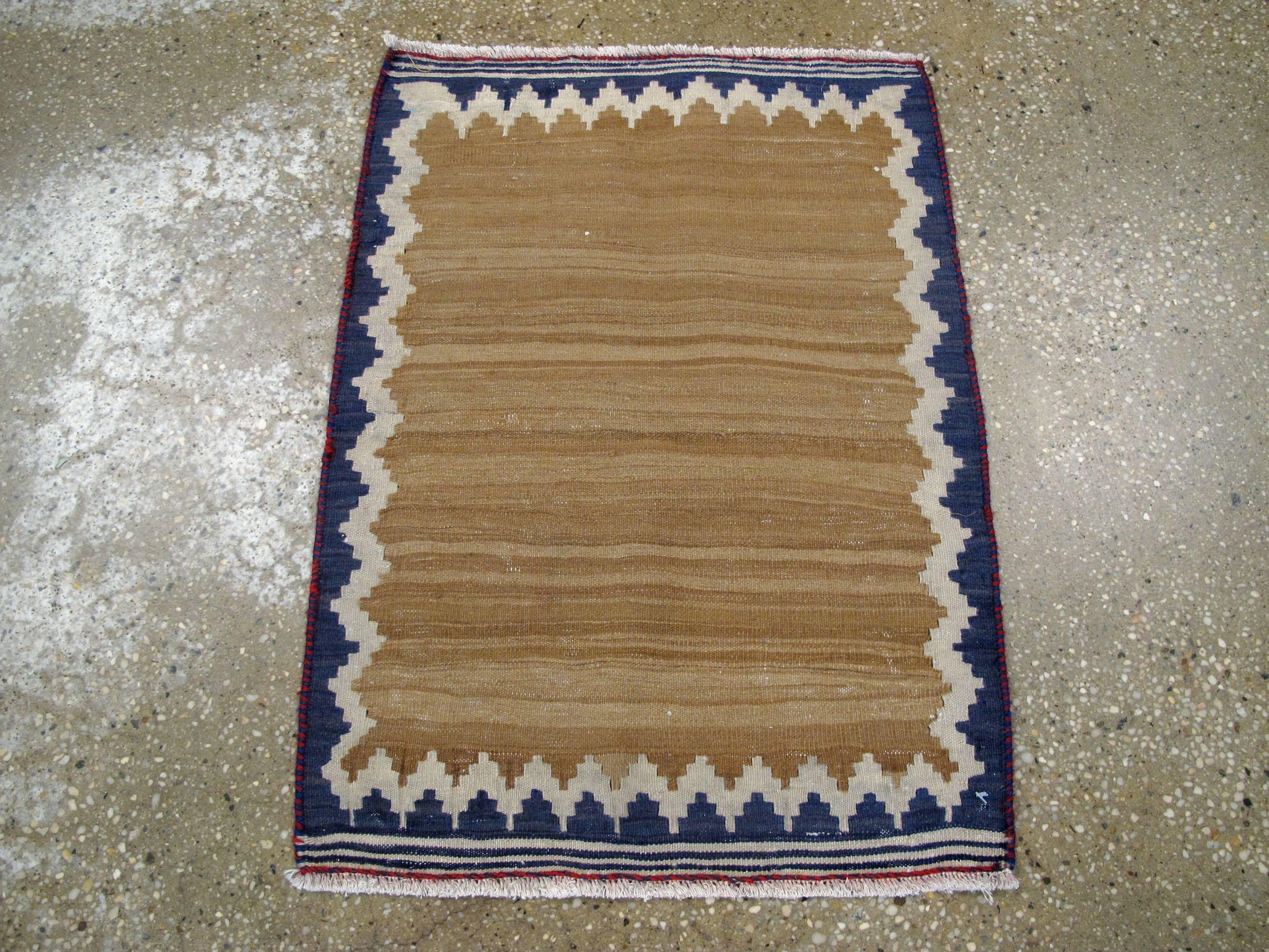 A vintage Persian Kilim flat-woven rug from the mid-20th century.

Measures: 1' 6