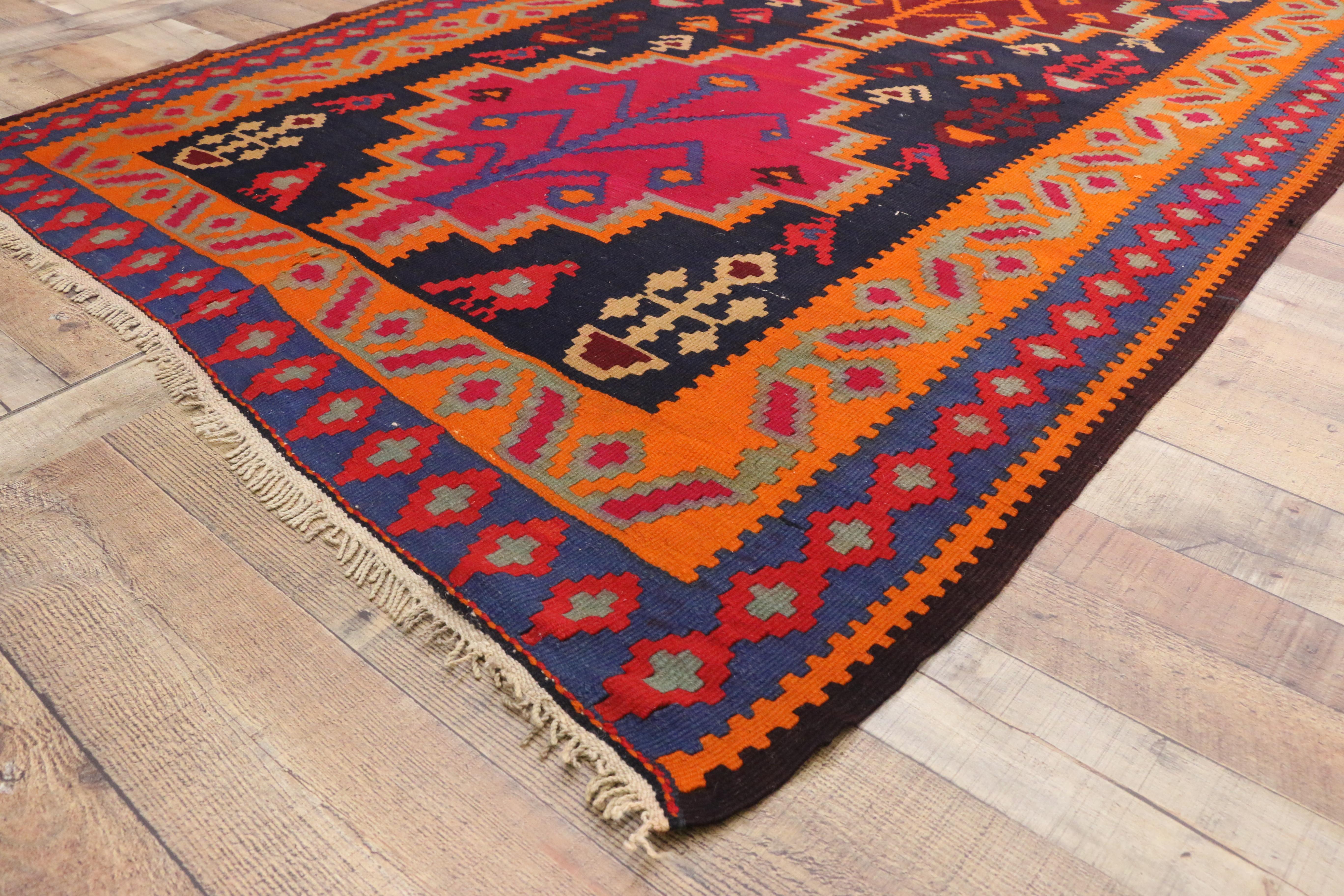 72067, vintage Persian Kilim gallery rug, wide hallway tribal runner. This handwoven wool vintage Persian Kilim gallery rug features three stepped diamond-shaped medallions spread across an ink blue field. Large tree of life motifs, which represent