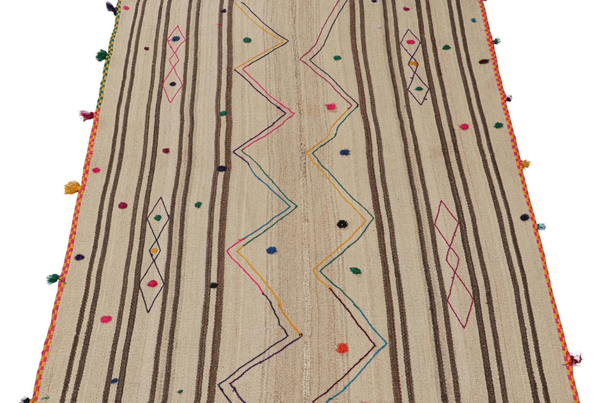 This vintage 4x6 Persian Kilim is a mid-century tribal rug, handwoven in wool circa 1950-1960. 

On the Design: 

The flatweave marks a playful take on tribal designs. It carries beige and brown stripes, and keen eyes will further admire