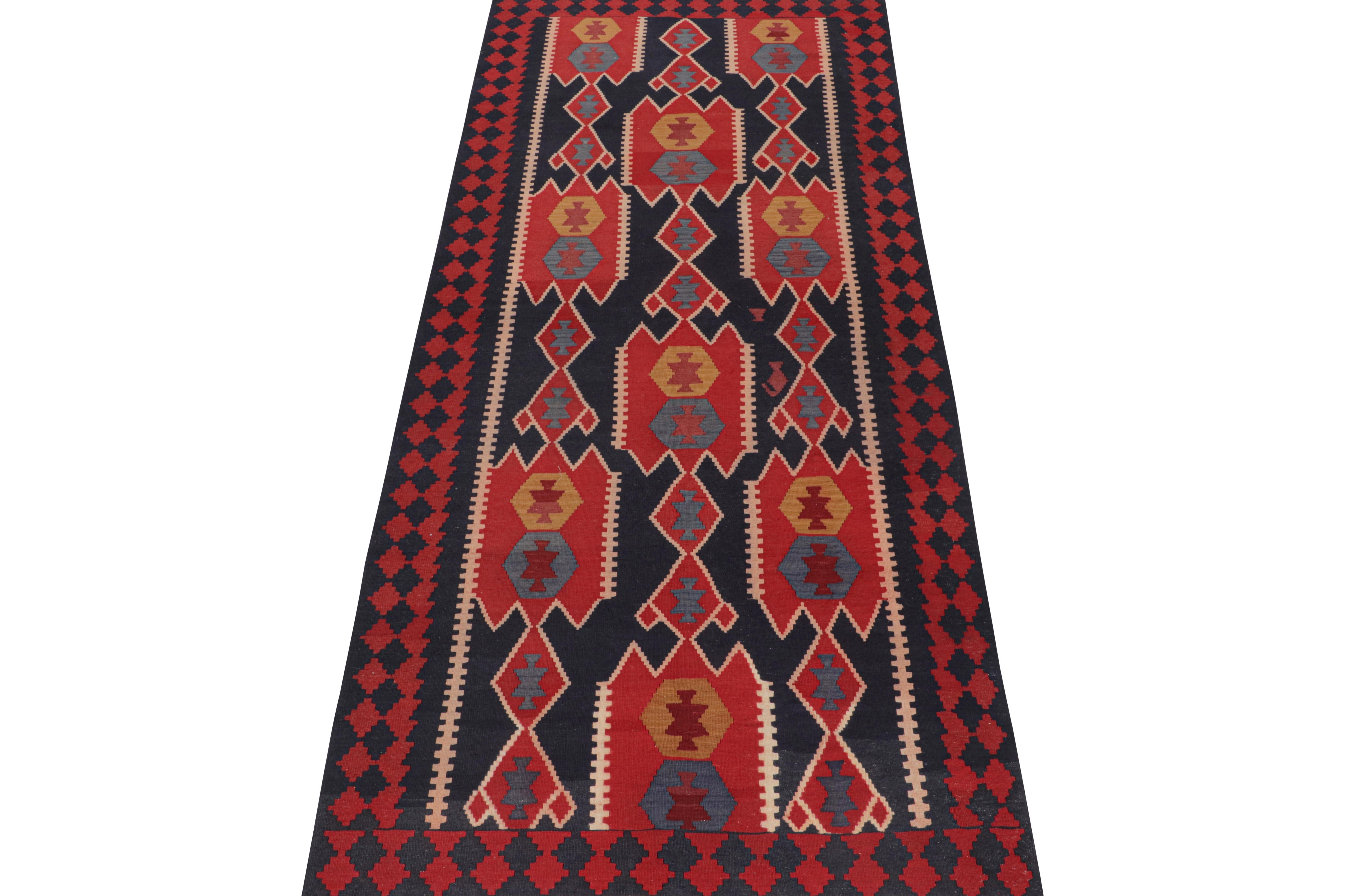 This vintage 4x11 Persian Kilim is a tribal rug from Meshkin—a small Northwest-Iranian village known for its fabulous works. Handwoven in wool, it originates circa 1950-1960. 

On the Design:

Its design favors traditional geometric patterns,