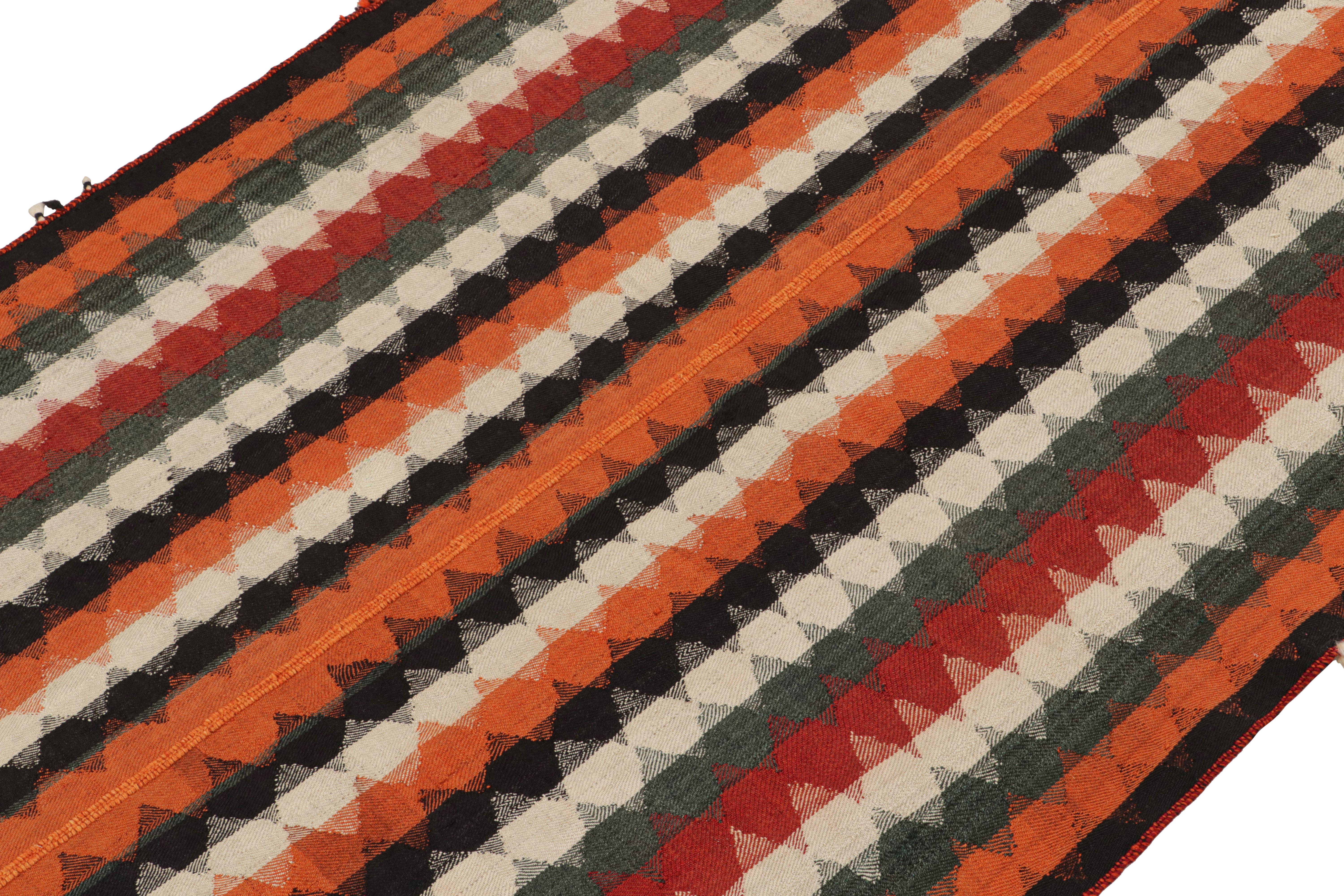 This vintage 4x7 Persian kilim is handwoven in wool, and originates circa 1950-1960.

On the Design: 

This design remarks the panel-weaving technique, in which tribal weavers combine multiple pieces into a larger Kilim. Its design favors