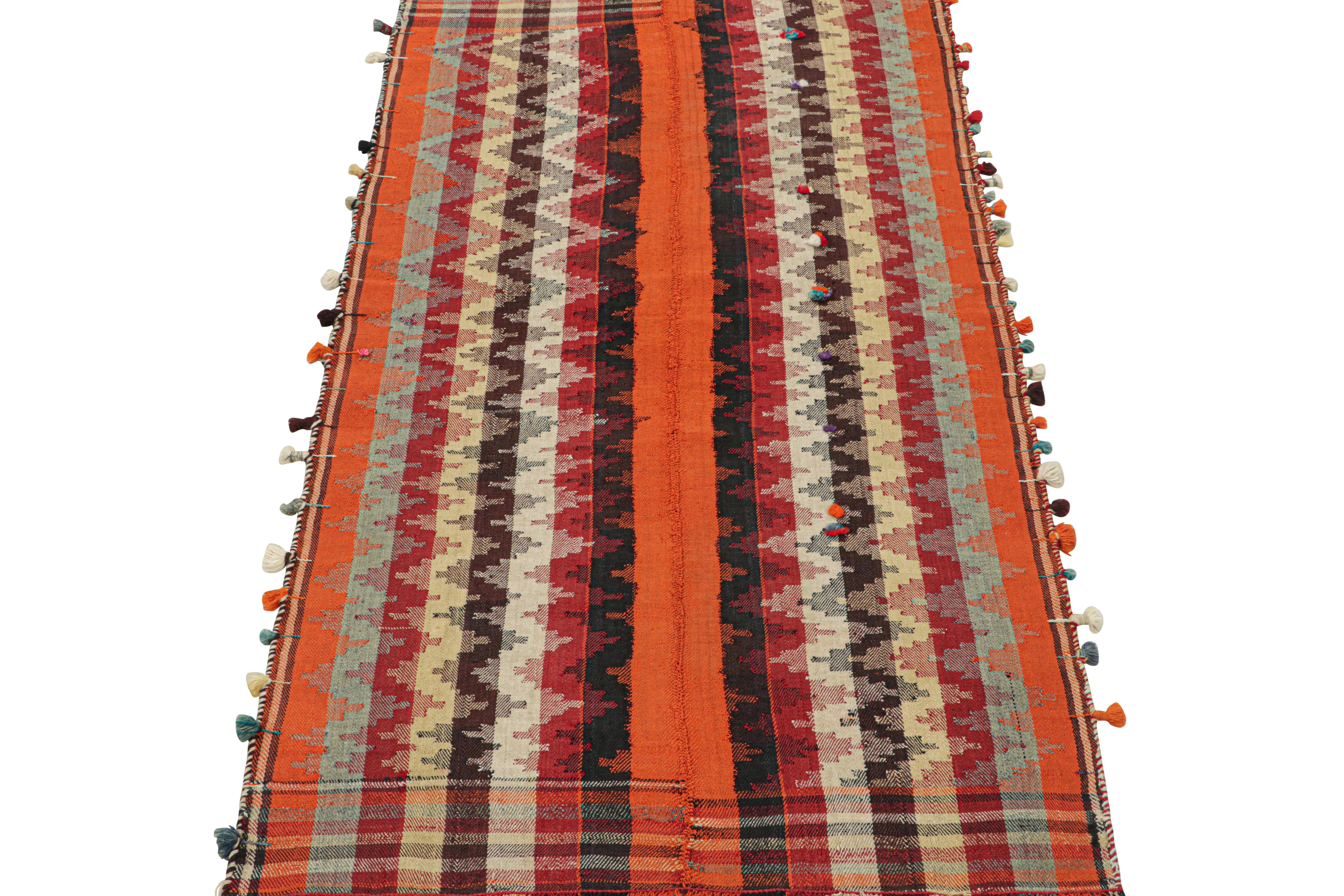 his vintage 4x7 Persian tribal kilim is handwoven in wool, and originates circa 1950-1960.

This design remarks the panel-weaving technique, in which tribal weavers combine multiple pieces into a larger Kilim. Its colorway is polychromatic, but