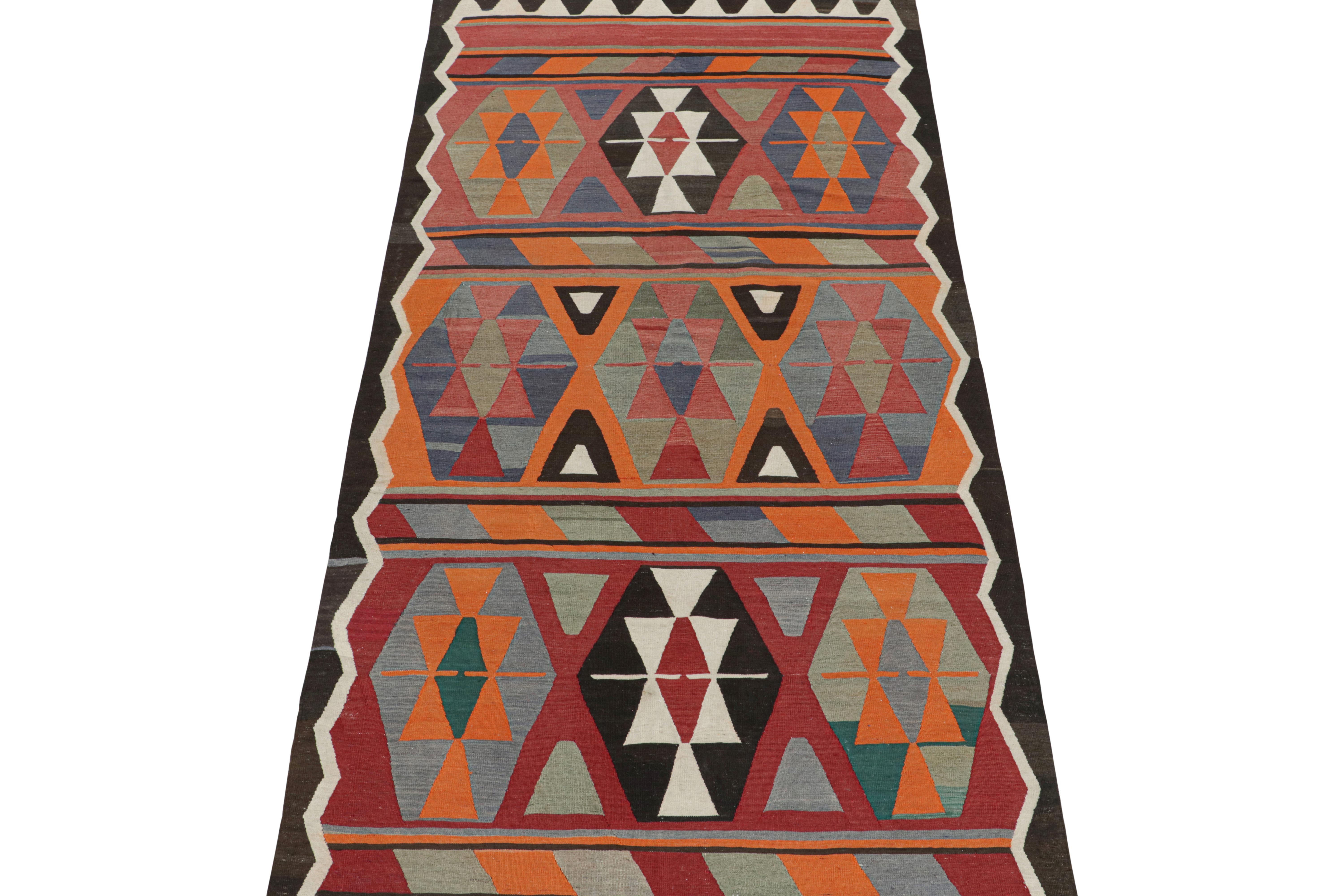 This vintage 5x11 Persian Kilim runner is handwoven in wool and originates circa 1950-1960. This Kilim is believed to hail from Meshkin—a small village known for its craft among what connoisseurs call 