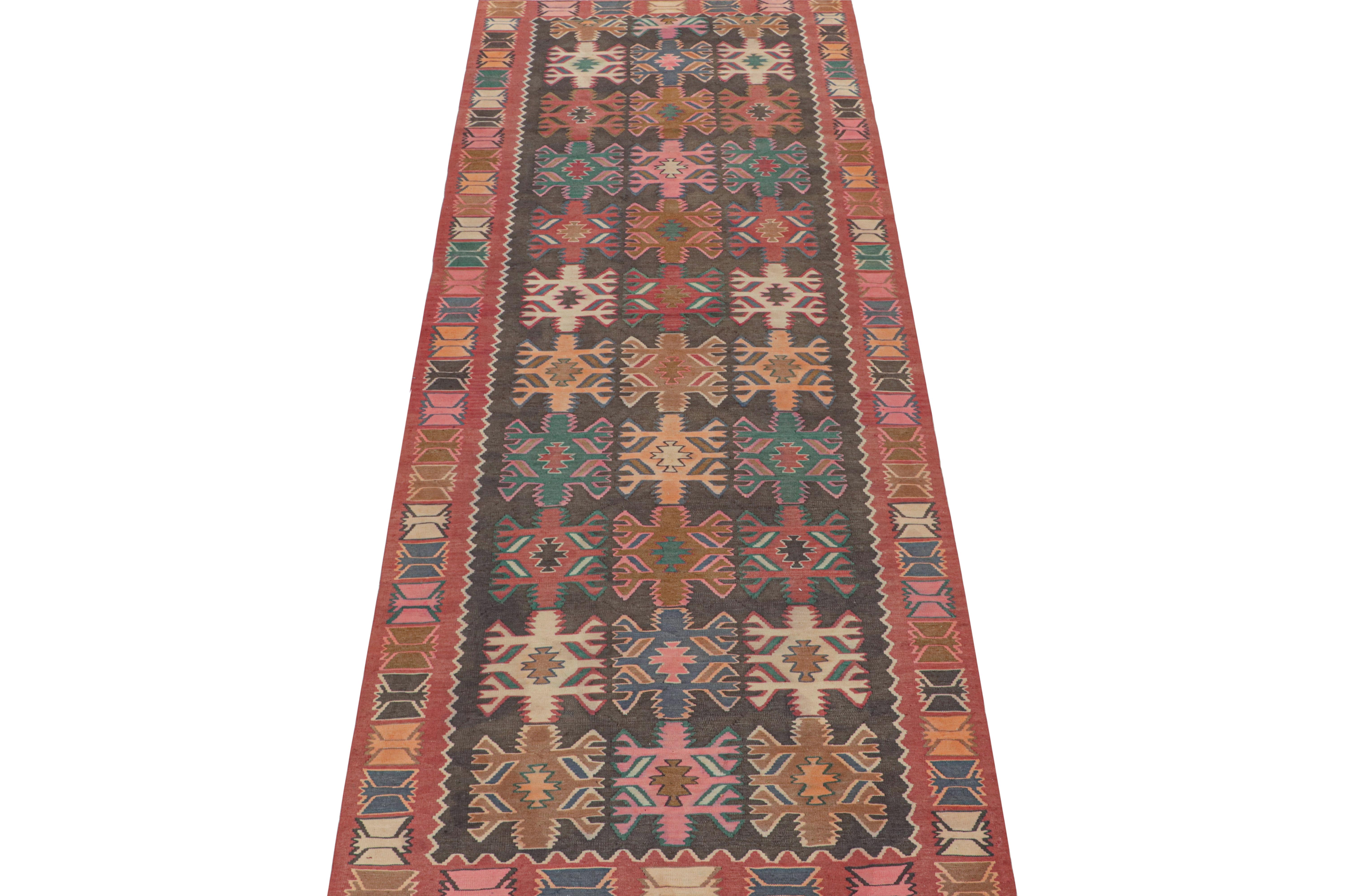 This vintage 5x13 Persian Kilim is a tribal rug believed to hail from Meshkin—a small Iranian village known for its craft.

Handwoven in wool circa 1950-1960, these are sometimes called Northwest designs—a well-known Persian provenance. Its design