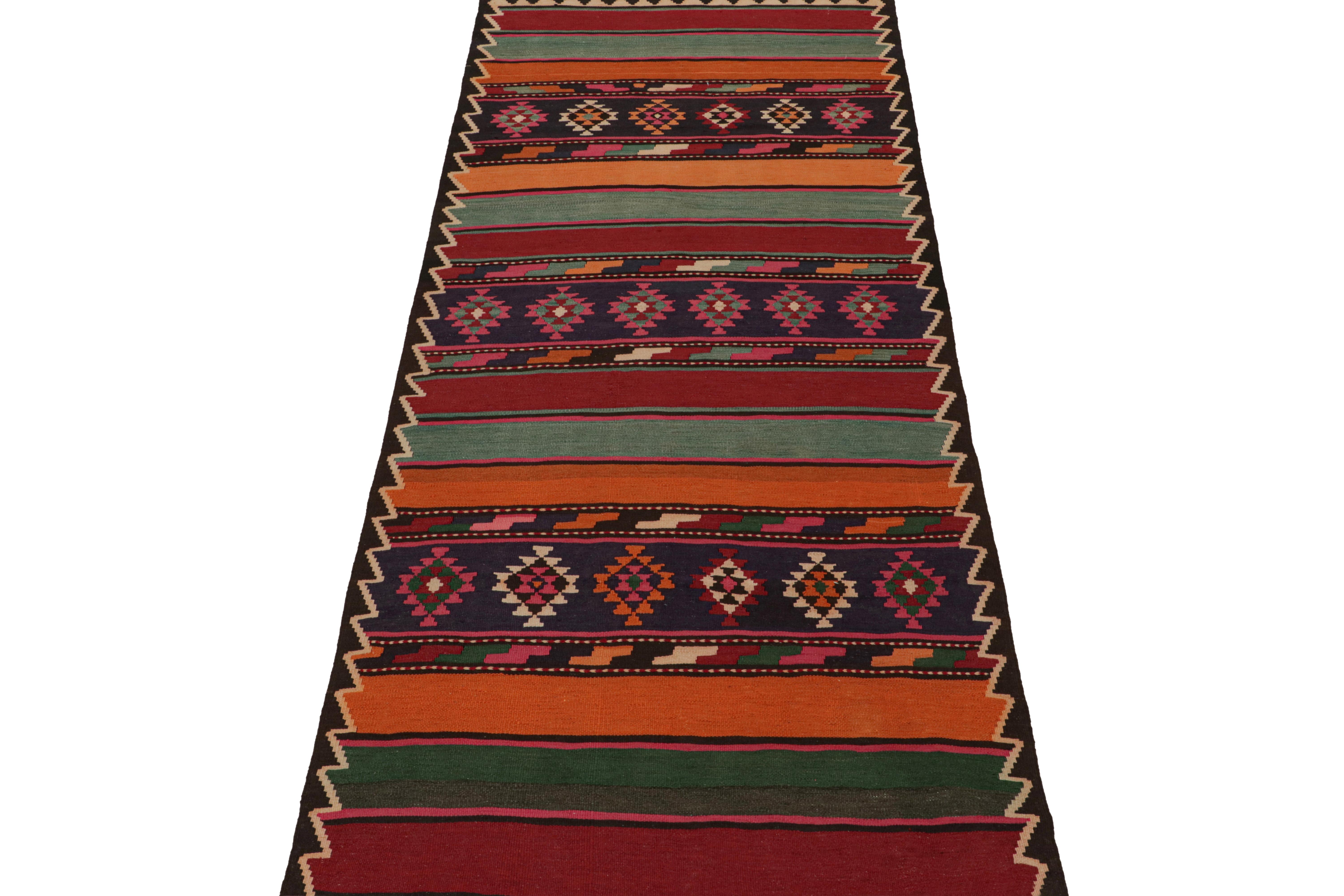 This vintage 5x12 Persian Kilim is a tribal rug from Meshkin—a small northwestern village known for its fabulous works. Handwoven in wool, it originates circa 1950-1960. 
On the Design:
Its design reads a complementary play of traditional