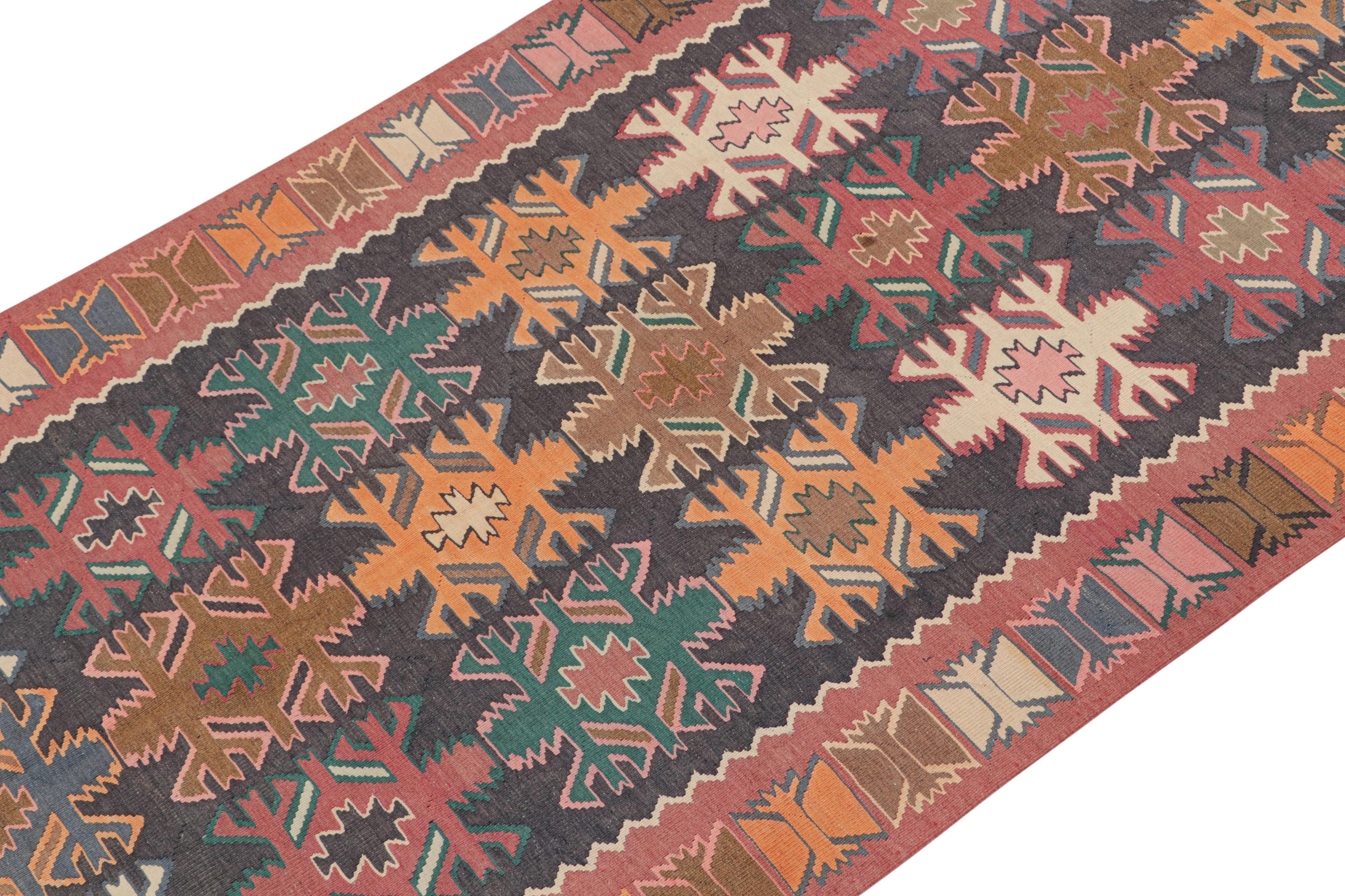 This vintage 5x13 Persian Kilim is a tribal rug from Meshkin—a small northwestern village known for its fabulous works. Handwoven in wool, it originates circa 1950-1960.

On the Design:

The bold design prefers a black field and salmon red border
