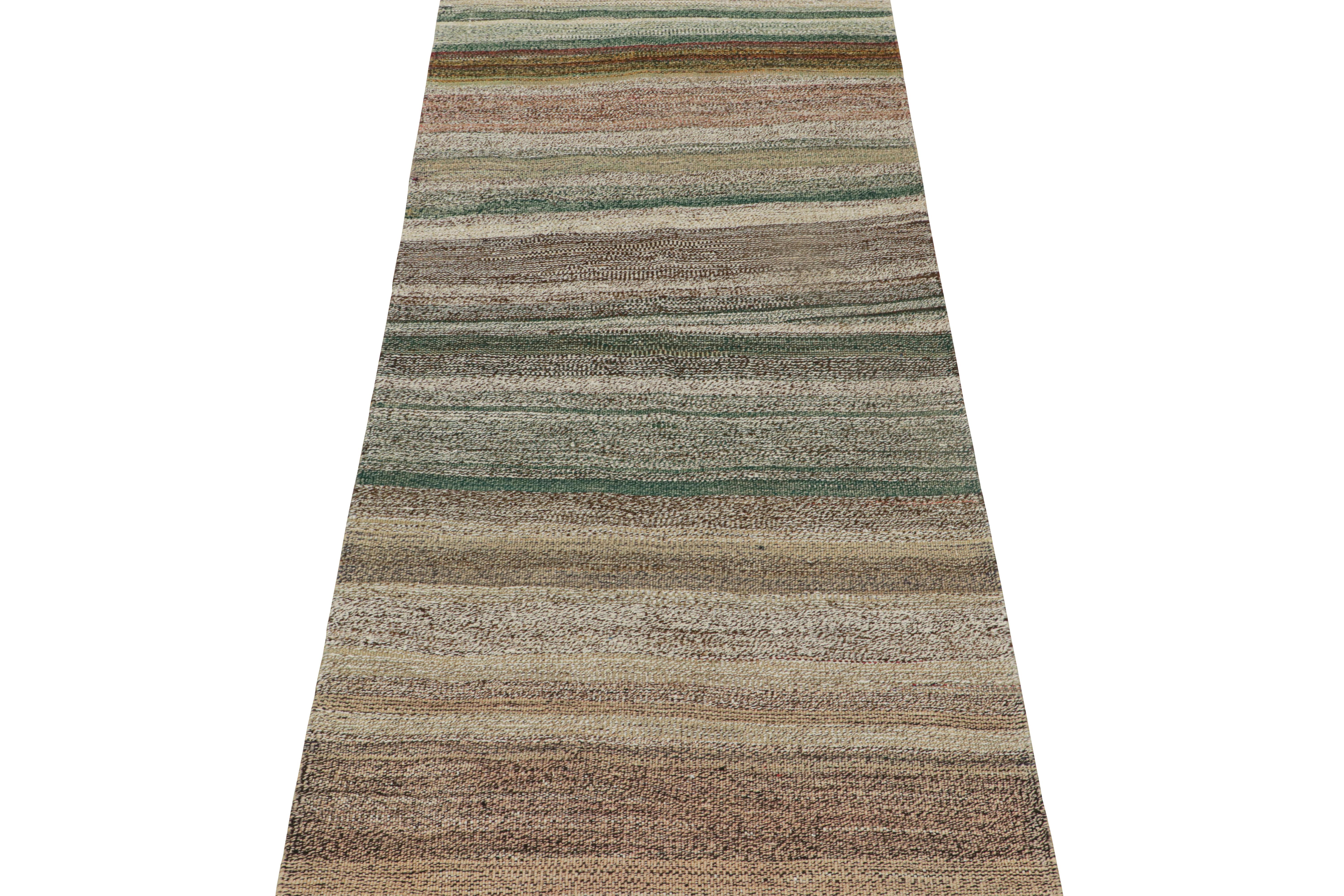 This vintage 4x9 Persian Kilim is a rare midcentury tribal runner, handwoven in wool circa 1950-1960. 

Its design enjoys a meticulous striae of colors—the sheer variety of which one seldom sees in its period. Keen eyes will note forest green,