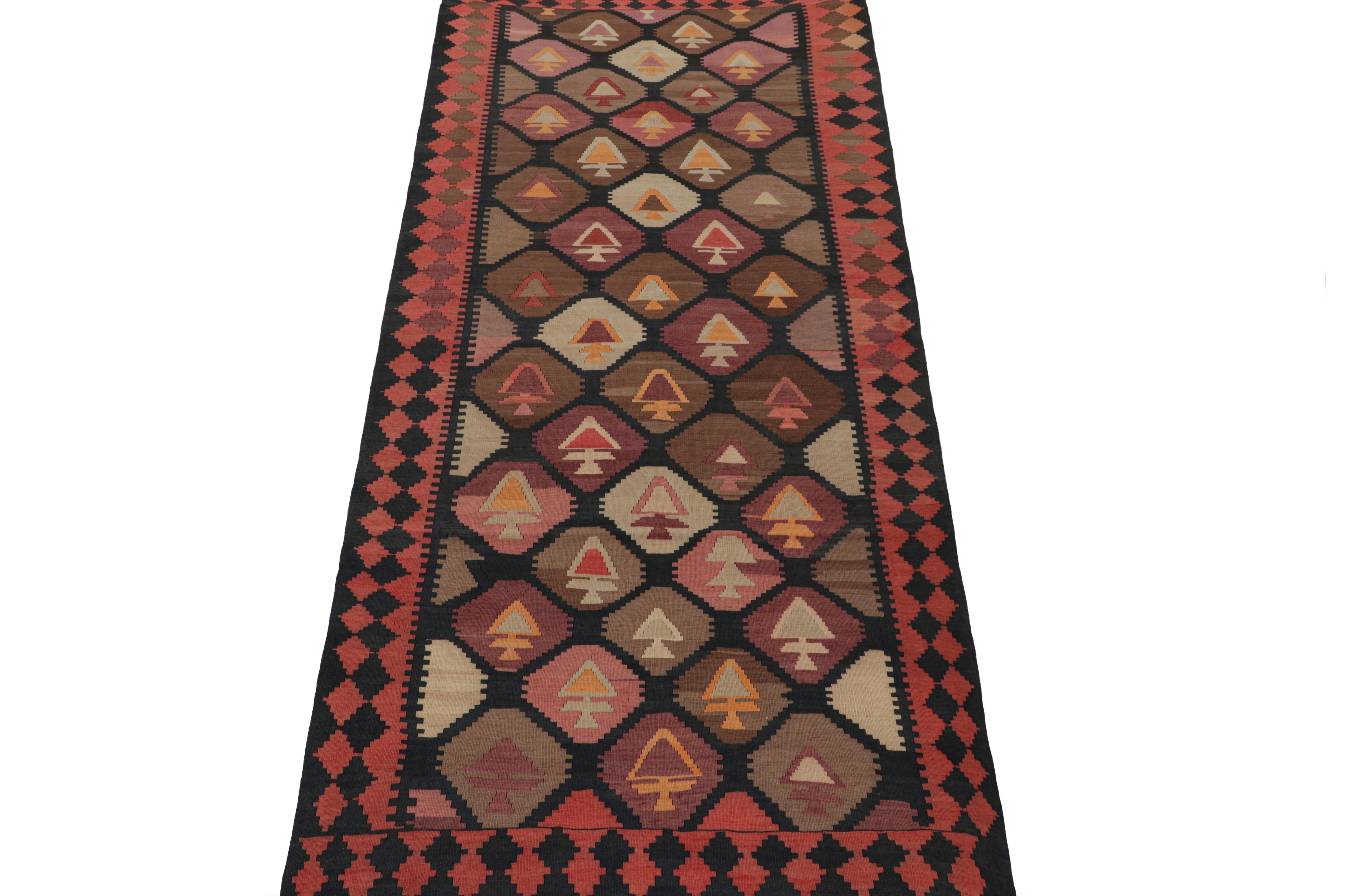 This vintage 5x12 Persian Kilim is a tribal rug from Meshkin—a small northwest village known for its fabulous works. Handwoven in wool, it originates circa 1950-1960. 

On the Design:

Its design enjoys a complementary play of rich brown, black