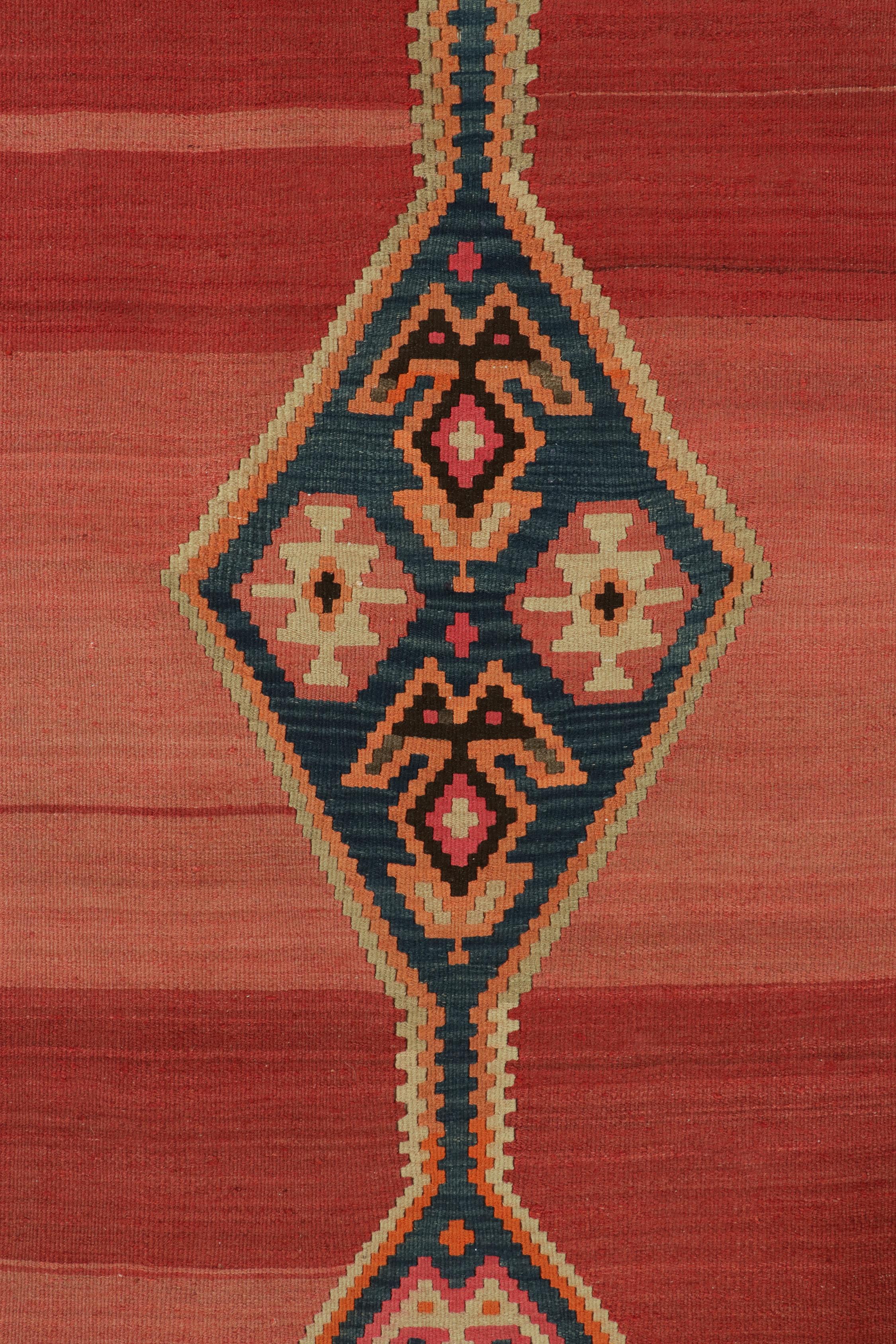 Mid-20th Century Vintage Persian Kilim in Red with Blue Medallion Pattern by Rug & Kilim For Sale