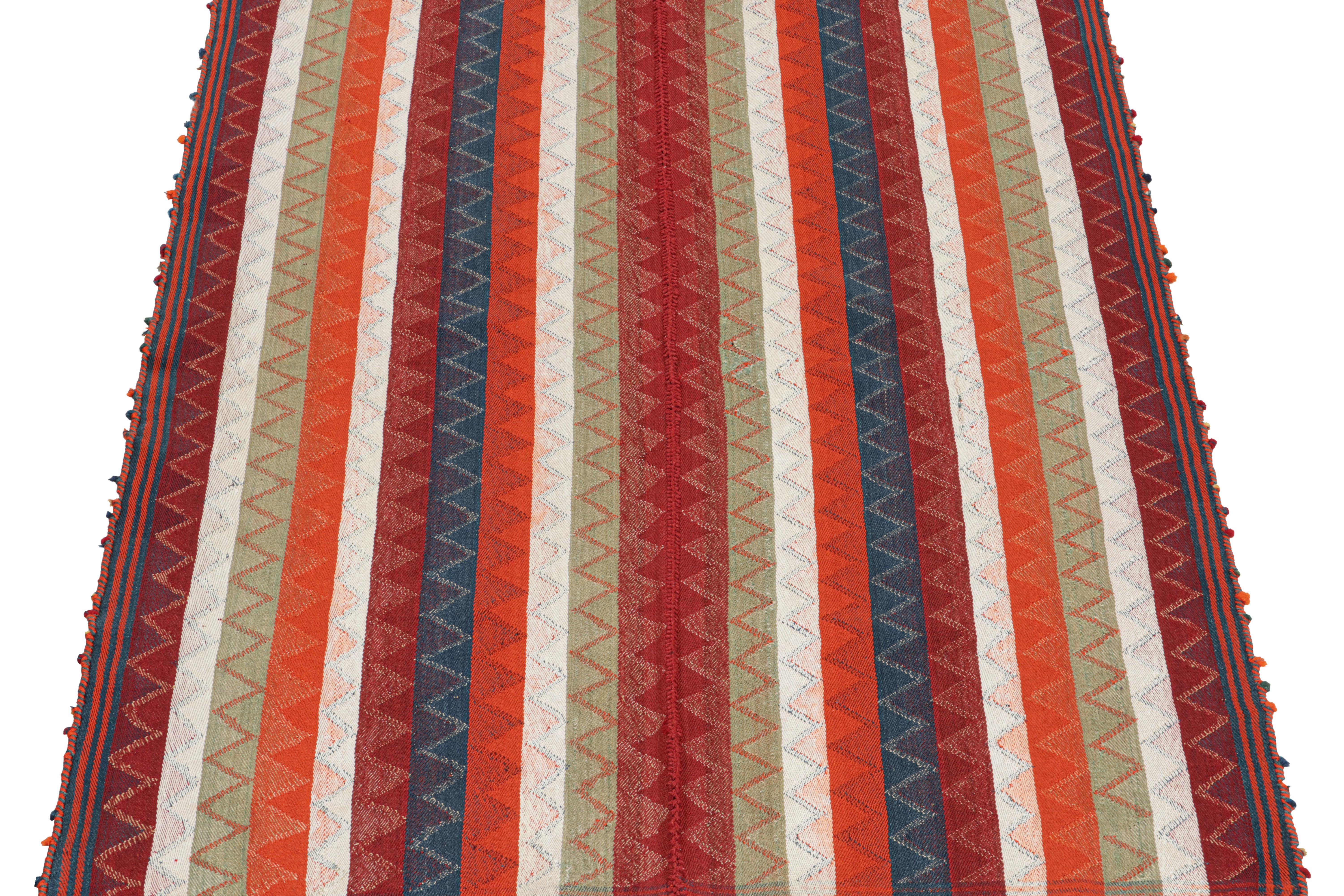 This vintage 5x7 Persian tribal kilim is handwoven in wool, and originates circa 1950-1960.

This design remarks the panel-weaving technique, in which tribal weavers combine multiple pieces into a larger Kilim. Its colorway is polychromatic, but