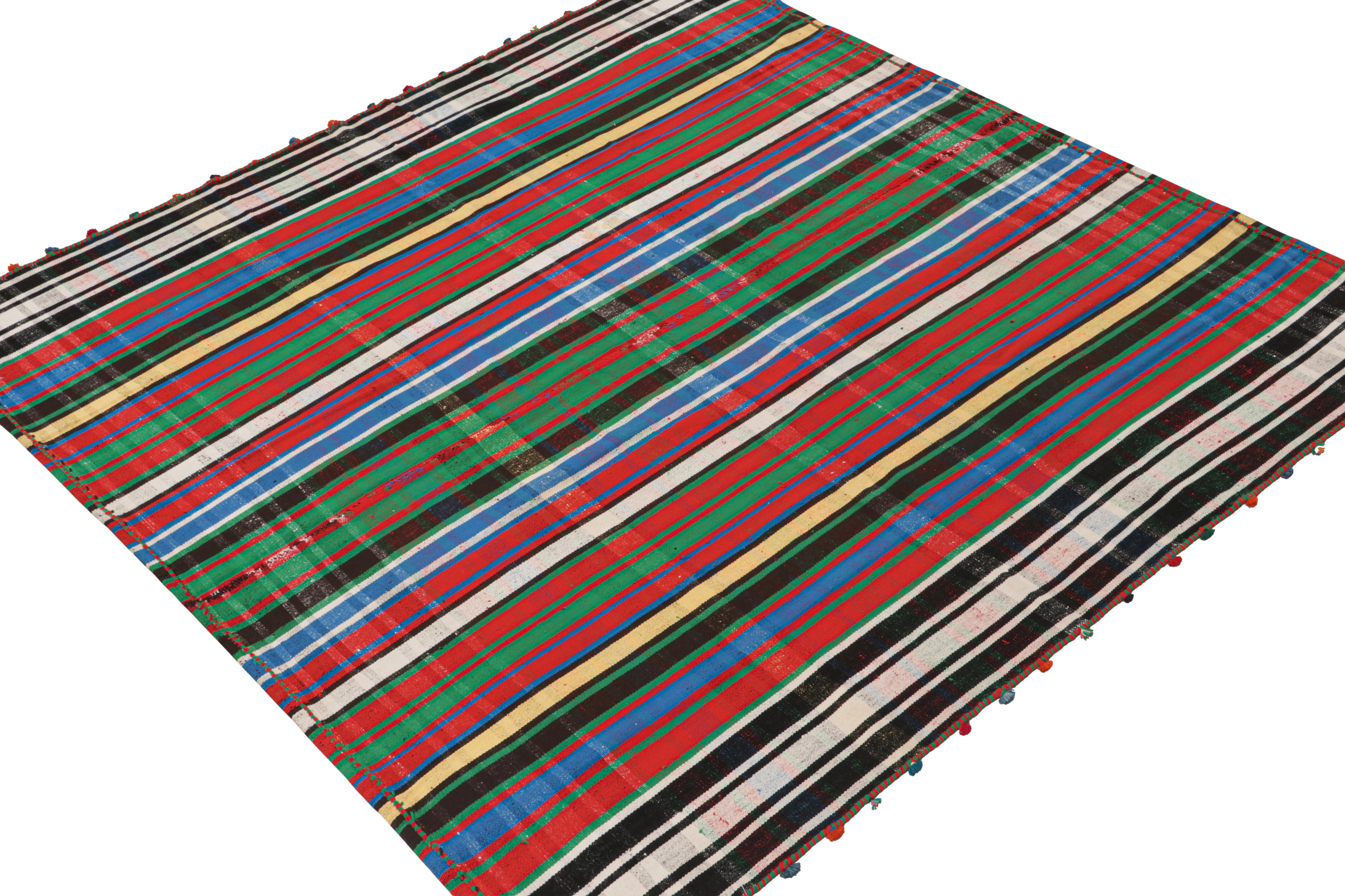 A vintage 5x6 Persian kilim rug, handwoven in wool circa 1950-1960.

Further on the Design:

Connoisseurs may appreciate this design’s panel-weaving technique, in which tribal weavers combine multiple pieces into larger Kilims. This method