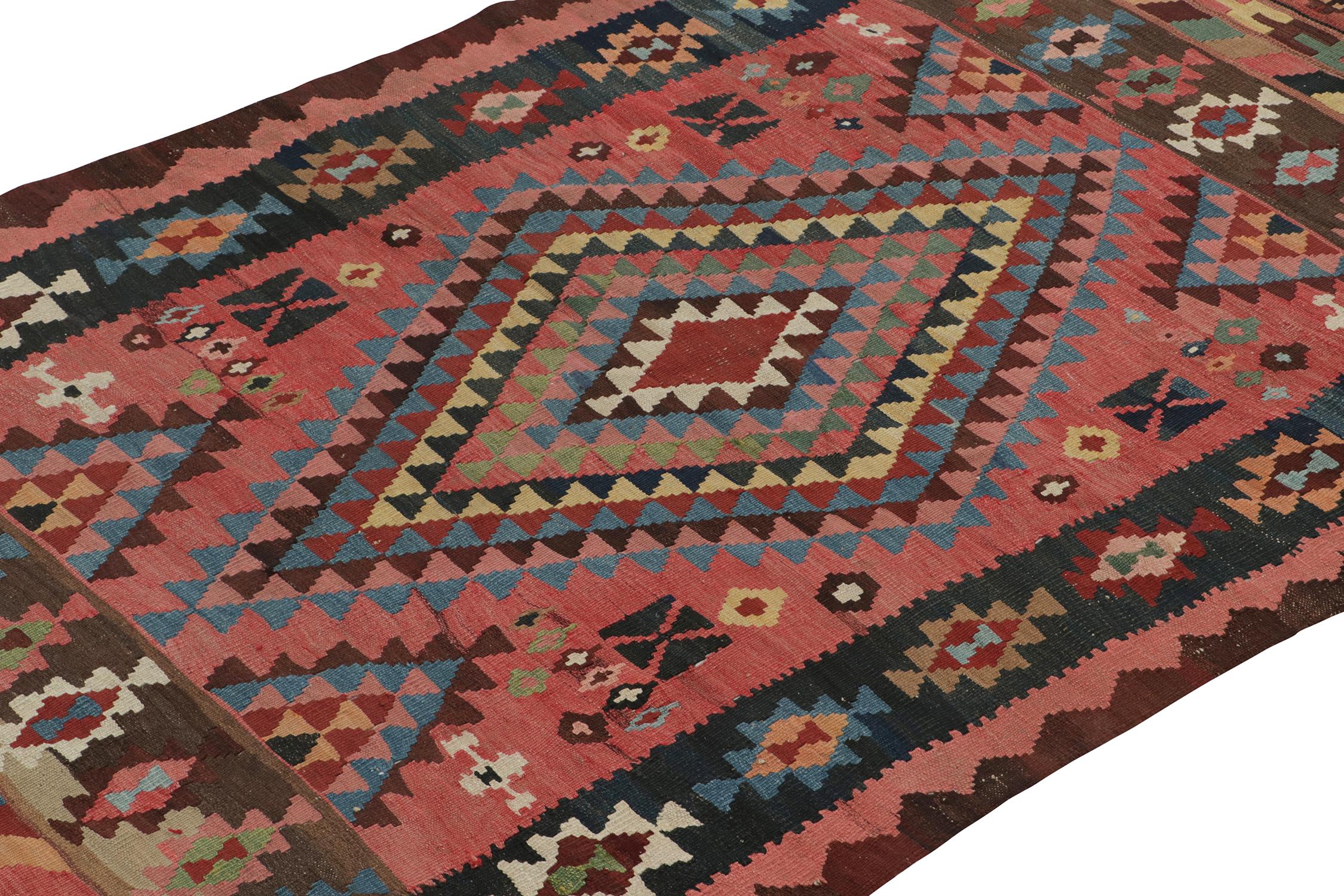 Hand-Knotted Vintage Persian Kilim rug in Pink with Geometric Patterns For Sale