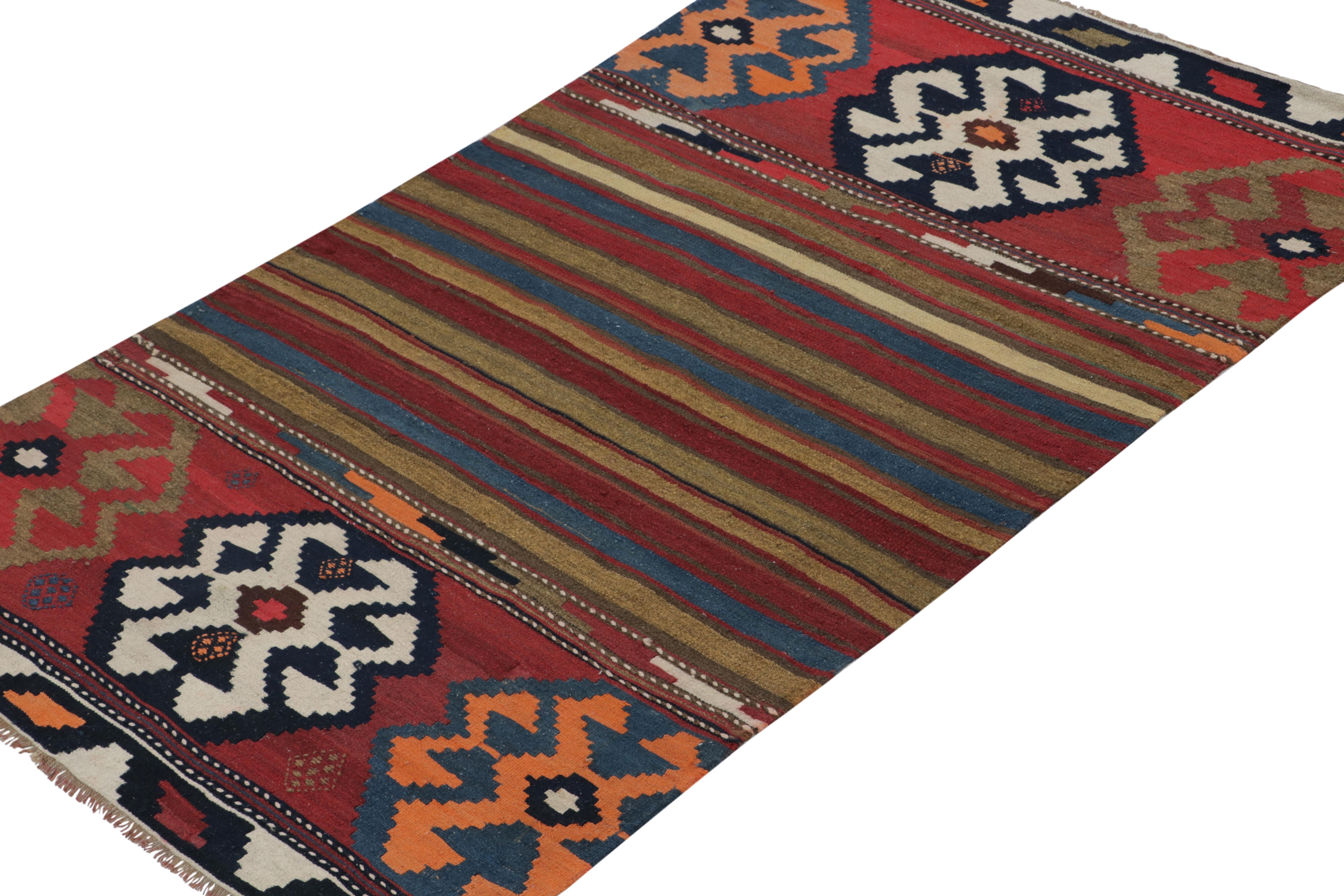 Tribal Vintage Persian Kilim Rug in Polychromatic Geometric Patterns by Rug & Kilim For Sale