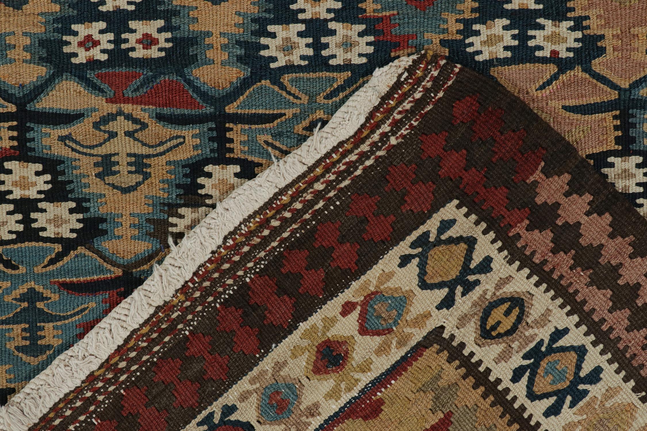 Wool Vintage Persian Kilim rug in Polychromatic Geometric Patterns For Sale