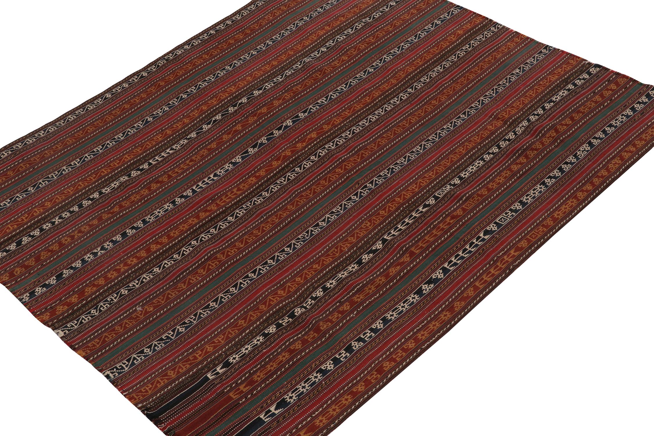 This vintage 6x6 Persian kilim is a unique tribal rug for its period, handwoven in wool circa 1950-1960.

Further on the Design:

The field enjoys vertical stripes with an emphasis on red, blue, black, brown and gold with white highlights.