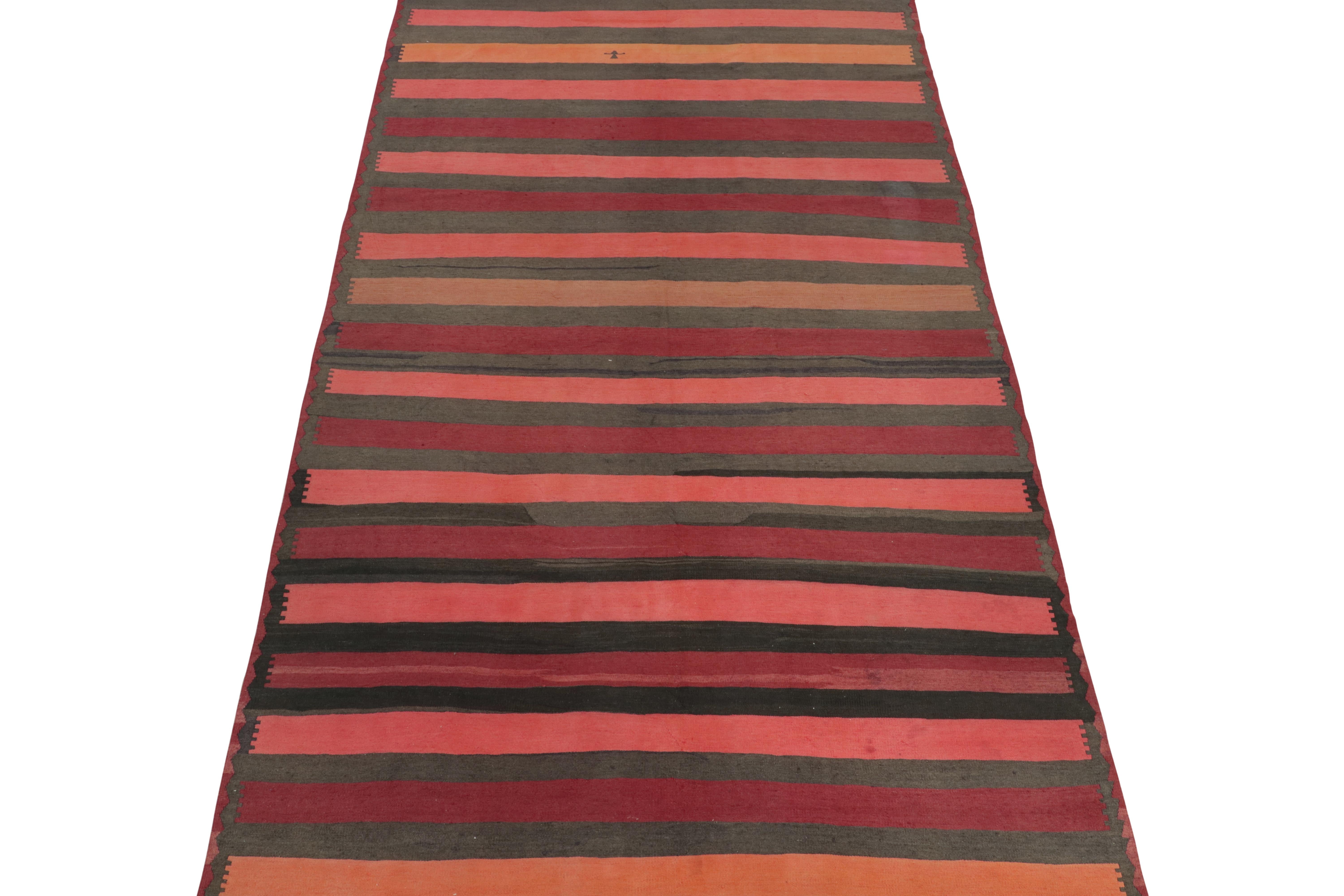 This vintage 7x12 Persian Kilim is a unique tribal rug for its period that hails from the Northwestern in Azerbaijan. Handwoven in wool, it originates circa 1950-1960.

Further on the Design:

The field hosts a series of horizontal stripes