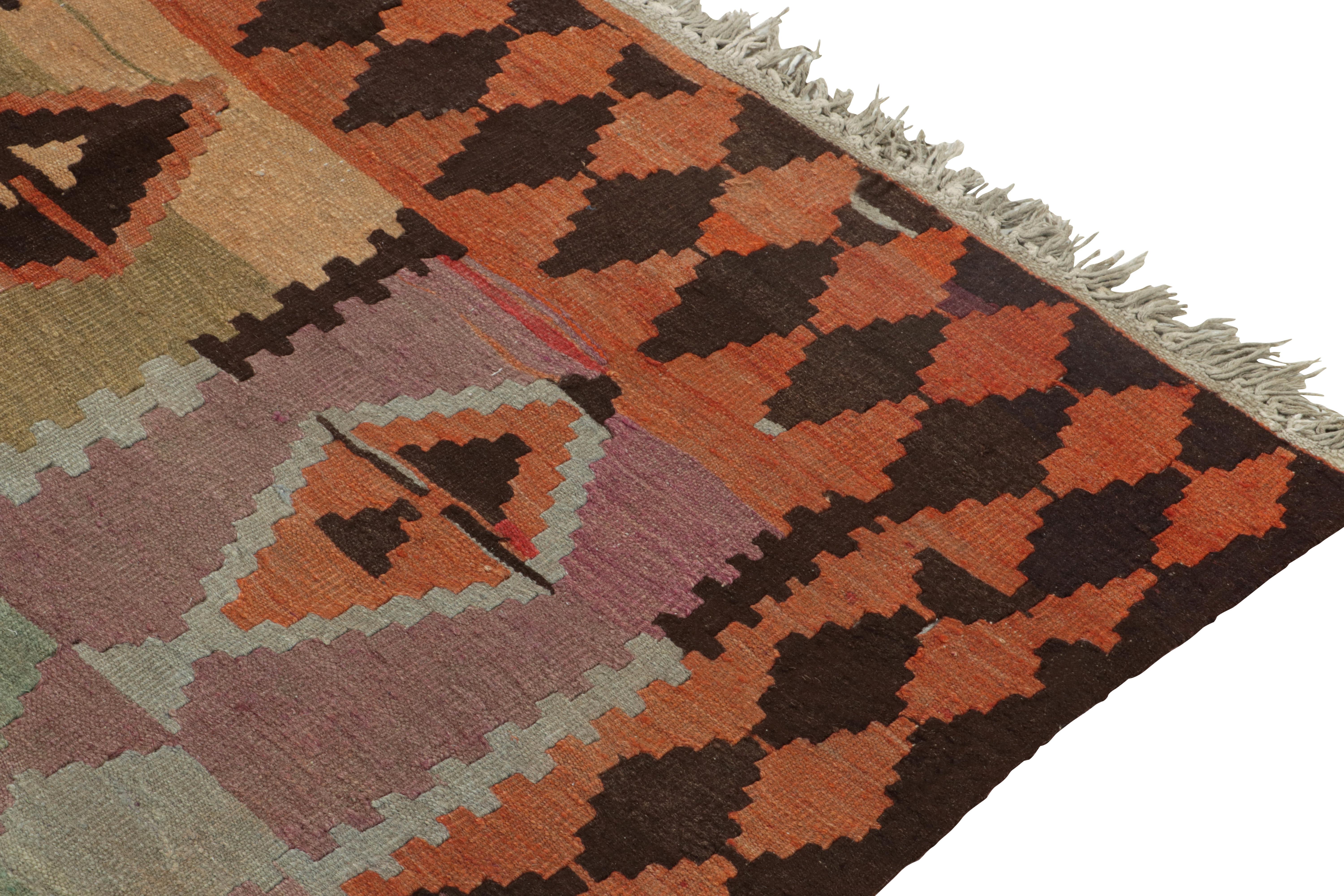 Mid-20th Century Vintage Persian Kilim rug in Red, Orange Tribal Geometric Pattern by Rug & Kilim For Sale