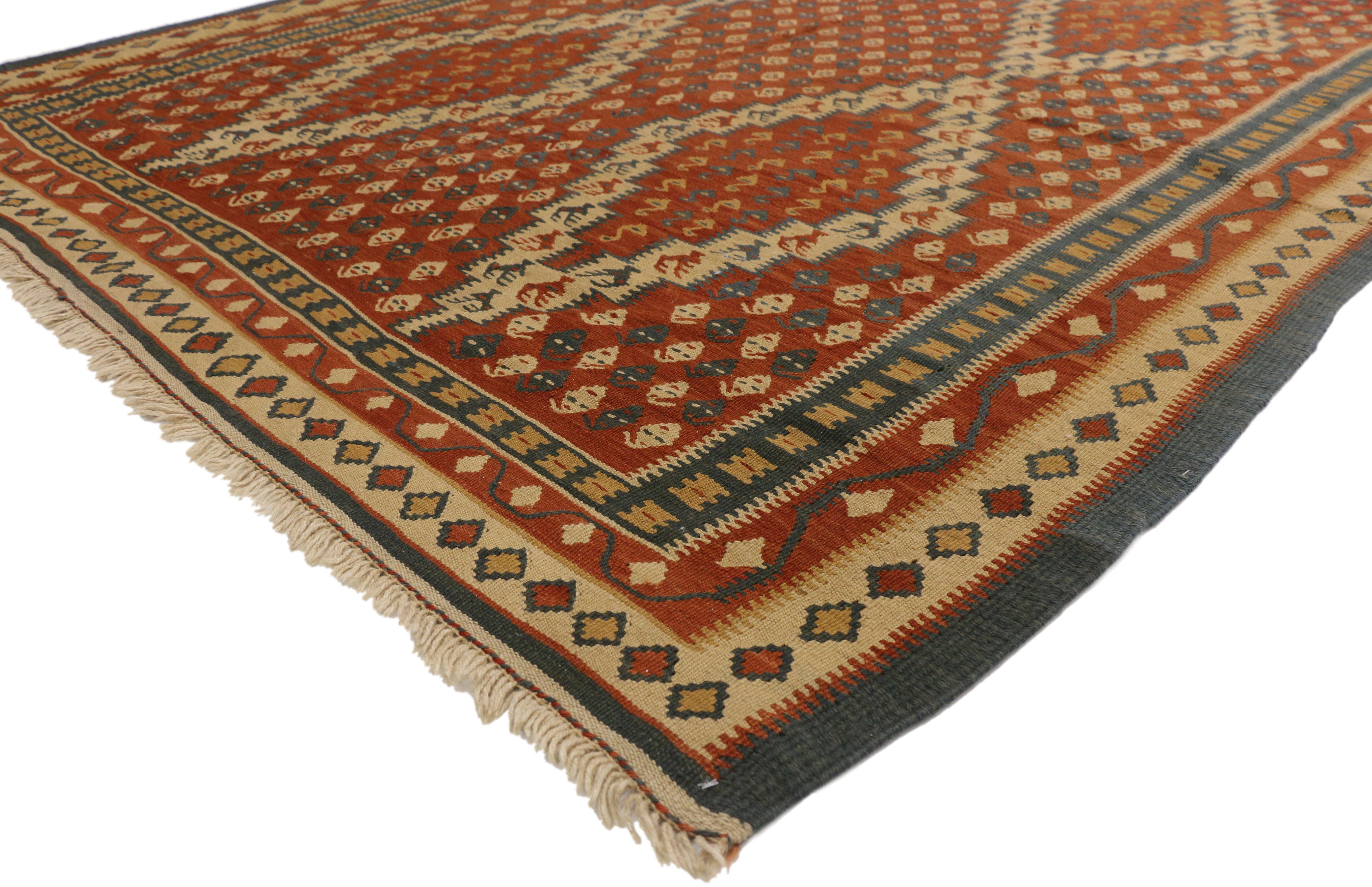 77294 Vintage Persian Kilim Rug with Nomadic Tribal Style 06'06 x 11'09. This handwoven wool vintage Persian Kilim area rug features two vertical columns of three stacked lozenges filled with repeating Cengel Hook motifs and outlined with beige