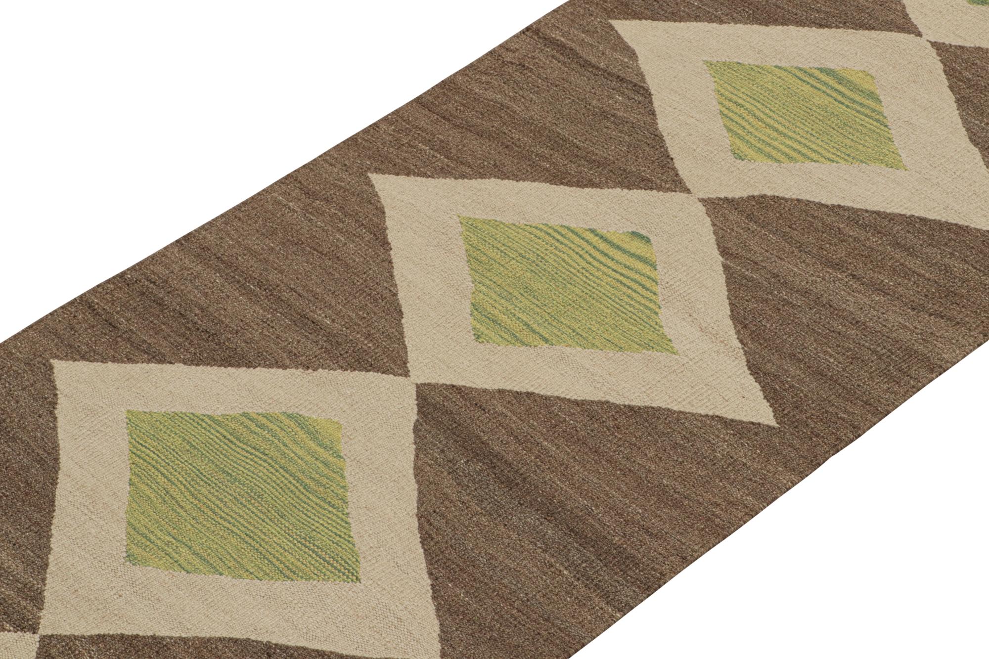This vintage 2x10 Persian Kilim is a midcentury tribal runner, handwoven in wool circa 1950-1960.

On the Design:

This flatweave enjoys a play of beige-brown and green in diamond-shaped medallions on an open field. Keen eyes will note the