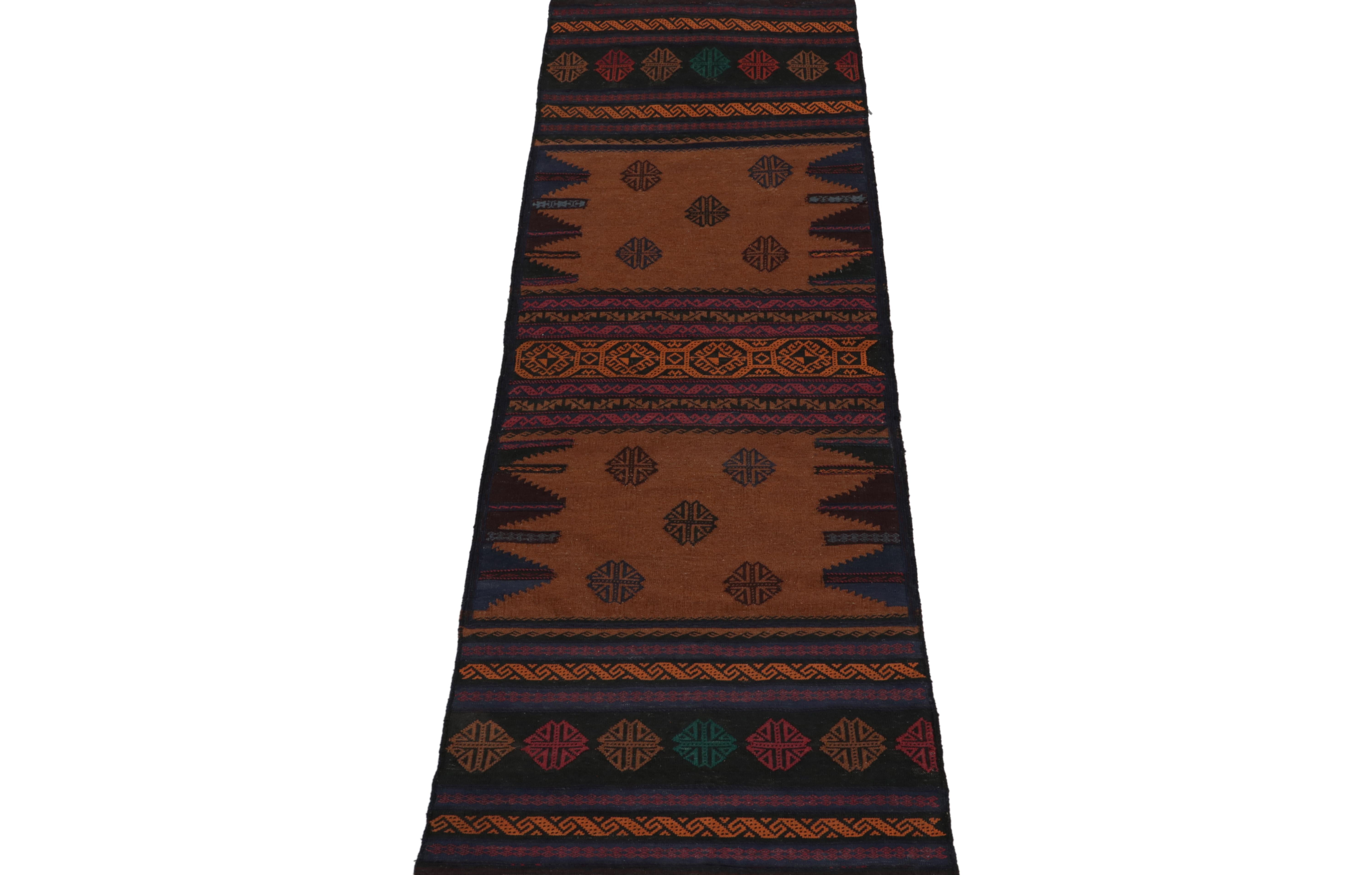 This vintage 3x8 Persian kilim is a unique tribal runner for its period, handwoven in wool circa 1950-1960.

Further on the Design:

The field enjoys patterns in an emphasis on brown, black, blue, red & orange variations - ultimately