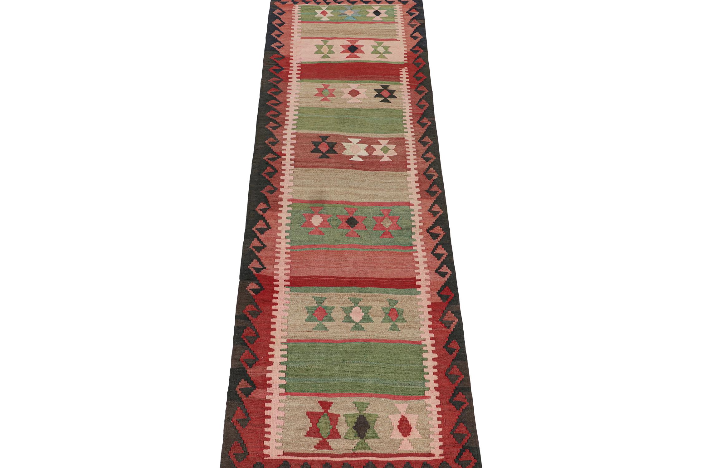 This vintage 3x12 Persian Kilim runner is handwoven in wool and originates circa 1950-1960. This Kilim is believed to hail from Meshkin—a small village known for its craft among what connoisseurs call 