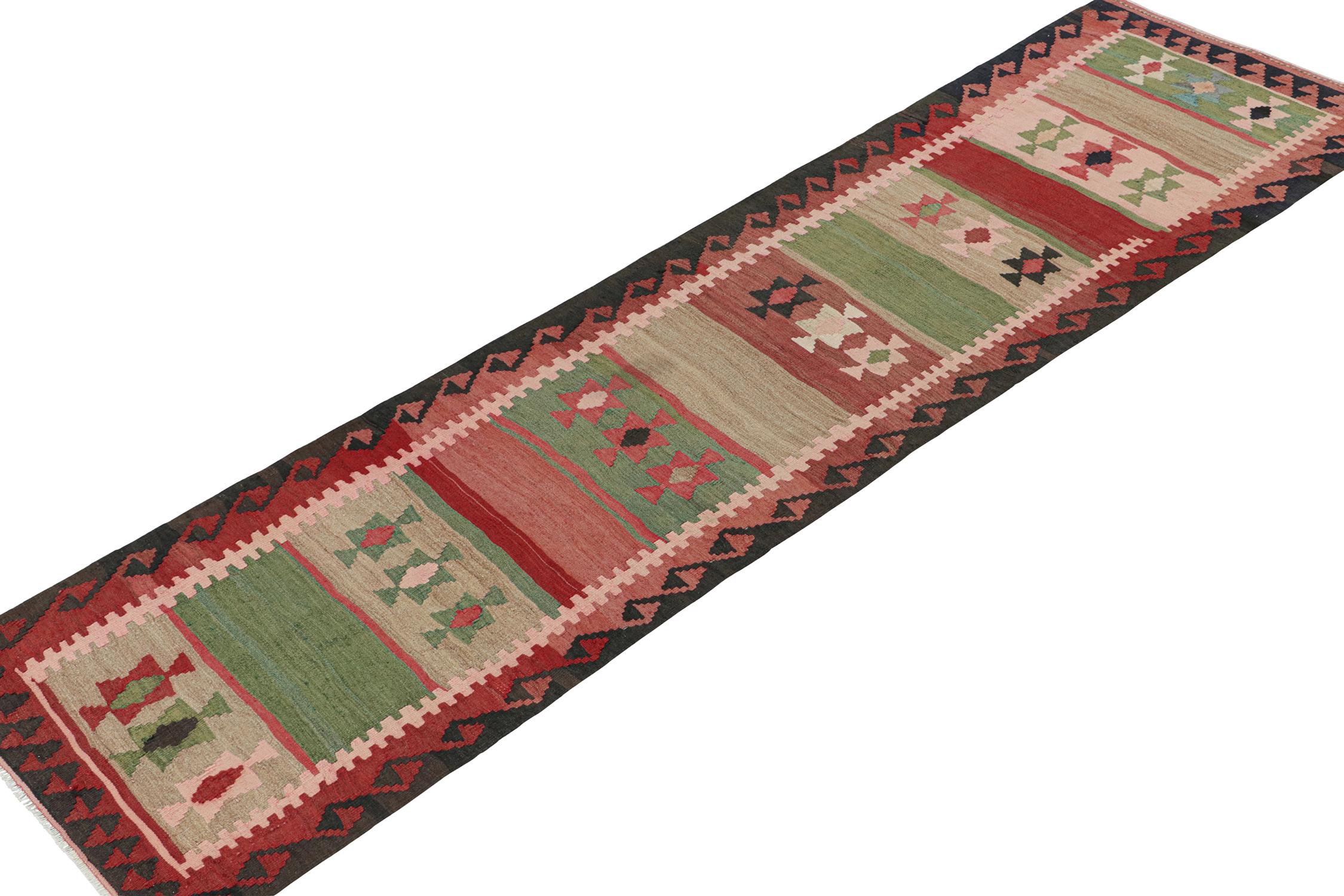 Tribal Vintage Persian Kilim Runner in Polychromatic Geometric Patterns by Rug & Kilim For Sale