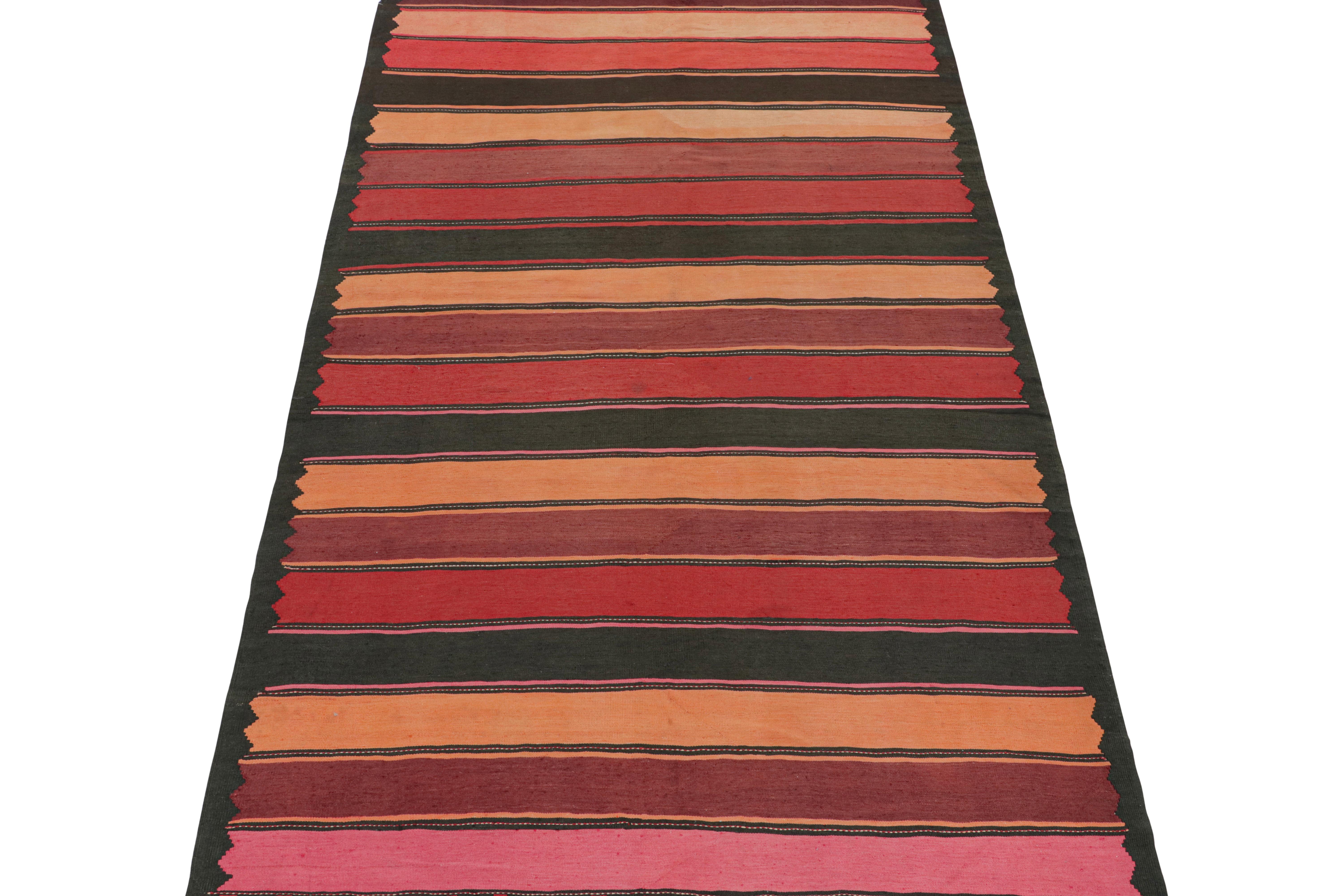 This vintage 7x12 Persian Kilim is believed to be a tribal Karadagh rug. Handwoven in wool, it originates circa 1940-1950 from the mountainous region of that name known for its craft.

Further on the Design:

The design favors wide stripes in