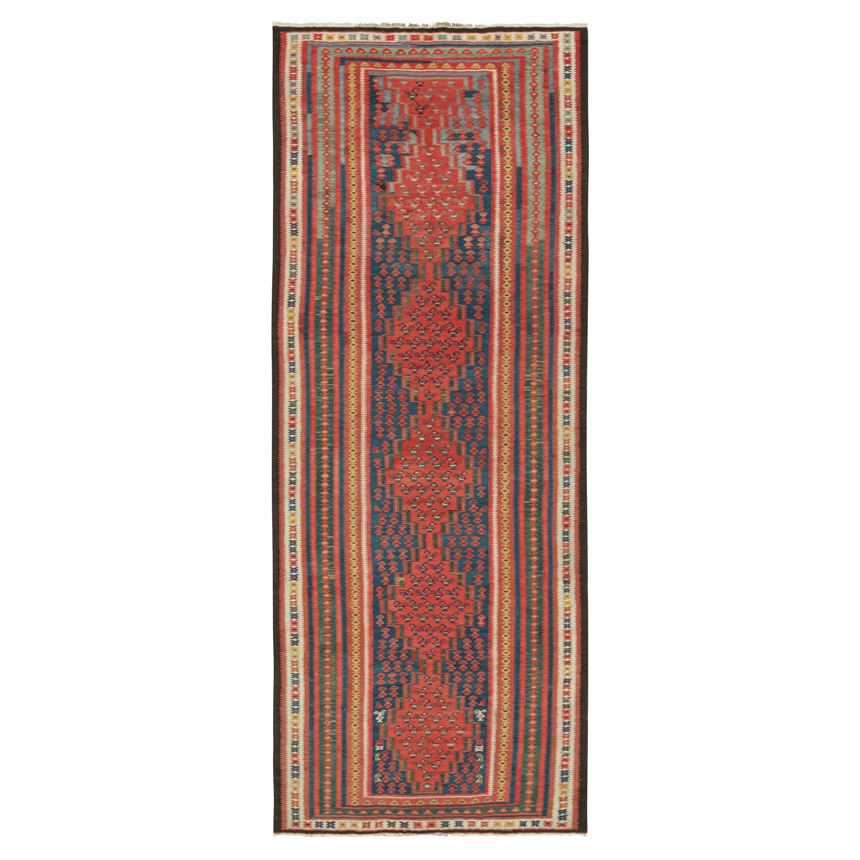 Kilim persiano vintage con medaglioni rossi e motivi geometrici di Rug & Kilim