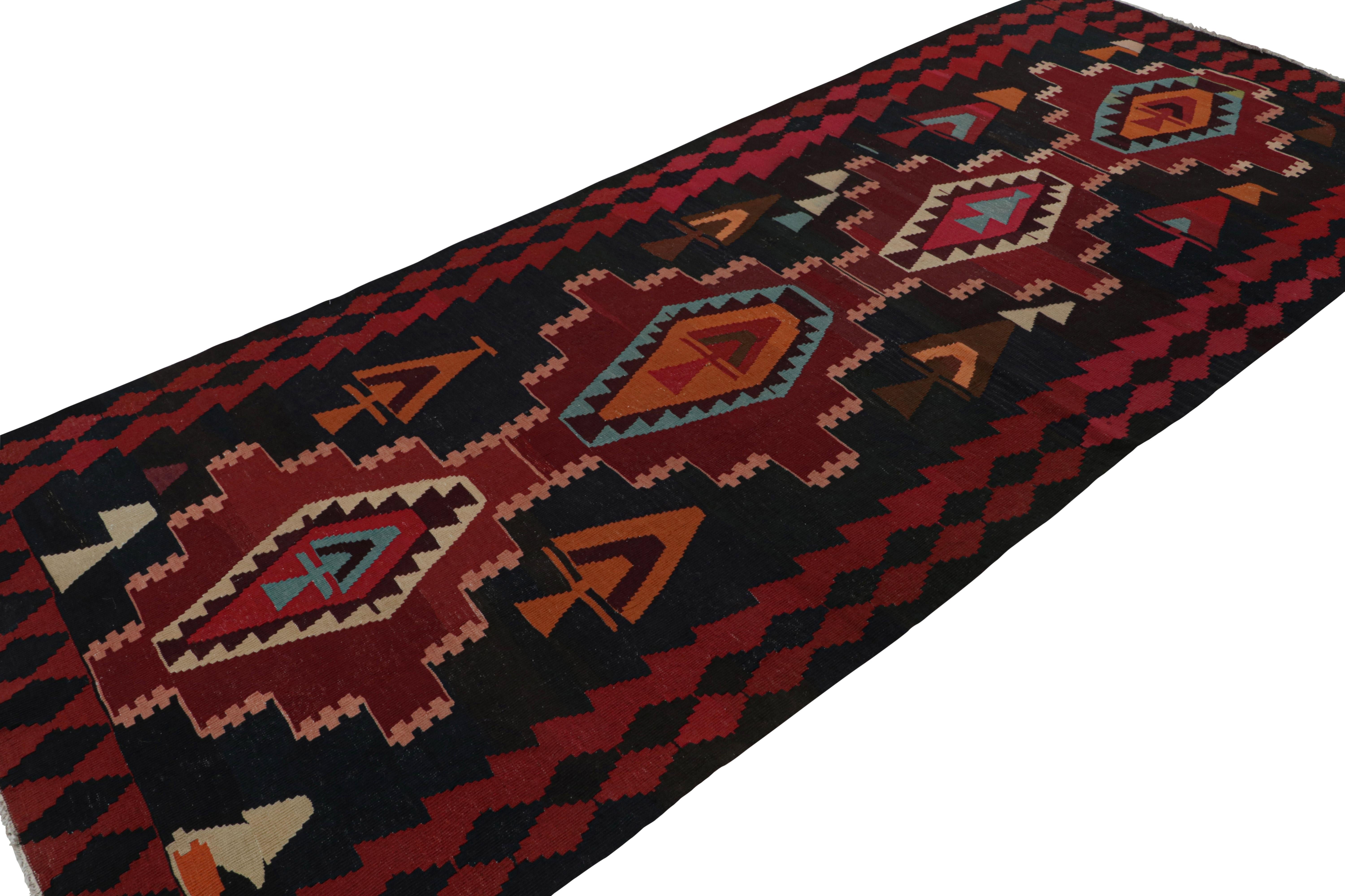 This vintage 5x12 Persian Kilim is the latest to join our Kilim & Flatweave collection. 

On the Design:

Handwoven in wool circa 1950-1960, the piece carries red medallions on a blue field. The gorgeous tribal piece is fabulously unique in its