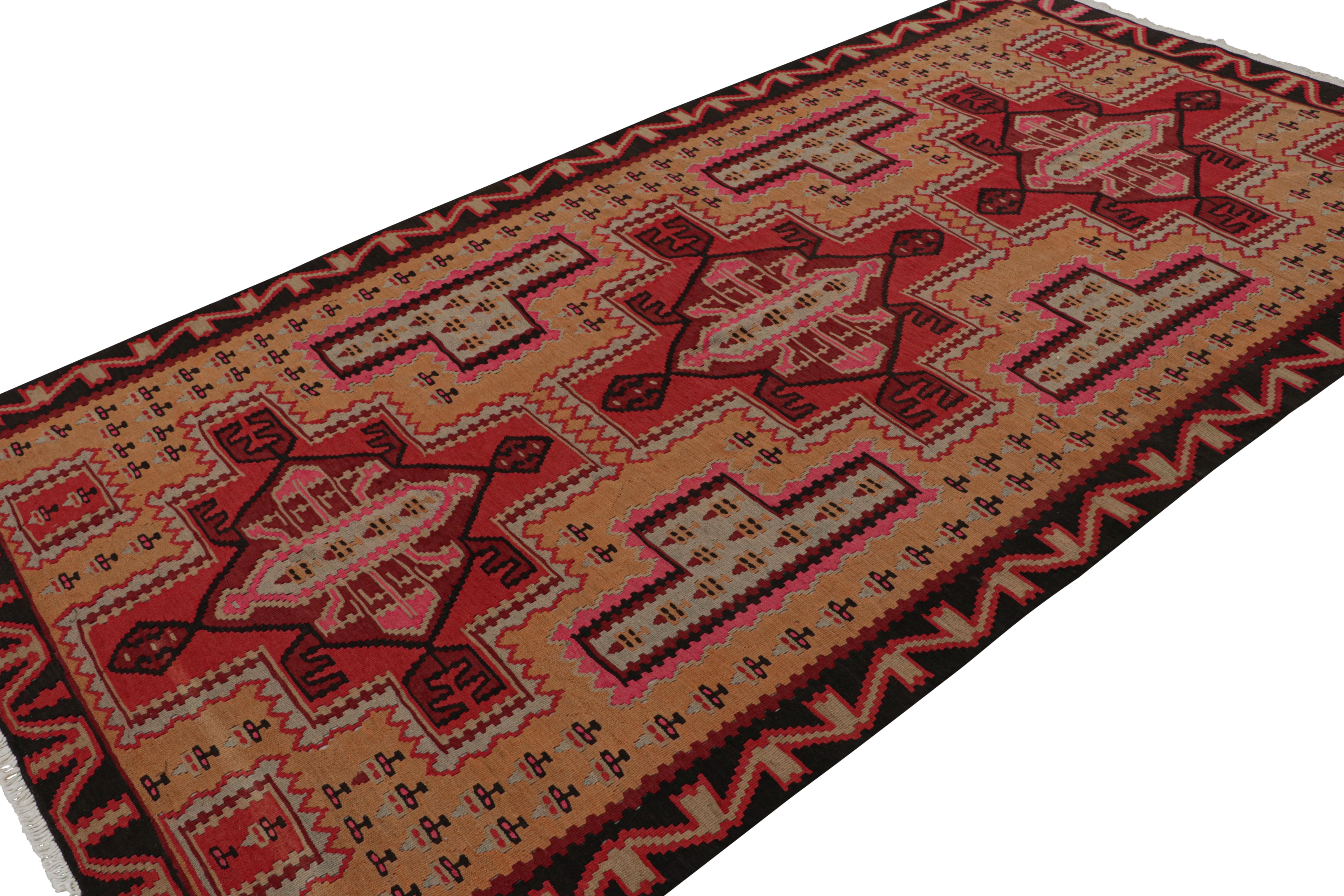 This vintage 5x10 Persian Kilim is the latest to join our Kilim & Flatweave collection. 

On the Design:

Handwoven in wool circa 1950-1960, the piece carries red medallions on a gold field. The medallions are further cocooned with all over