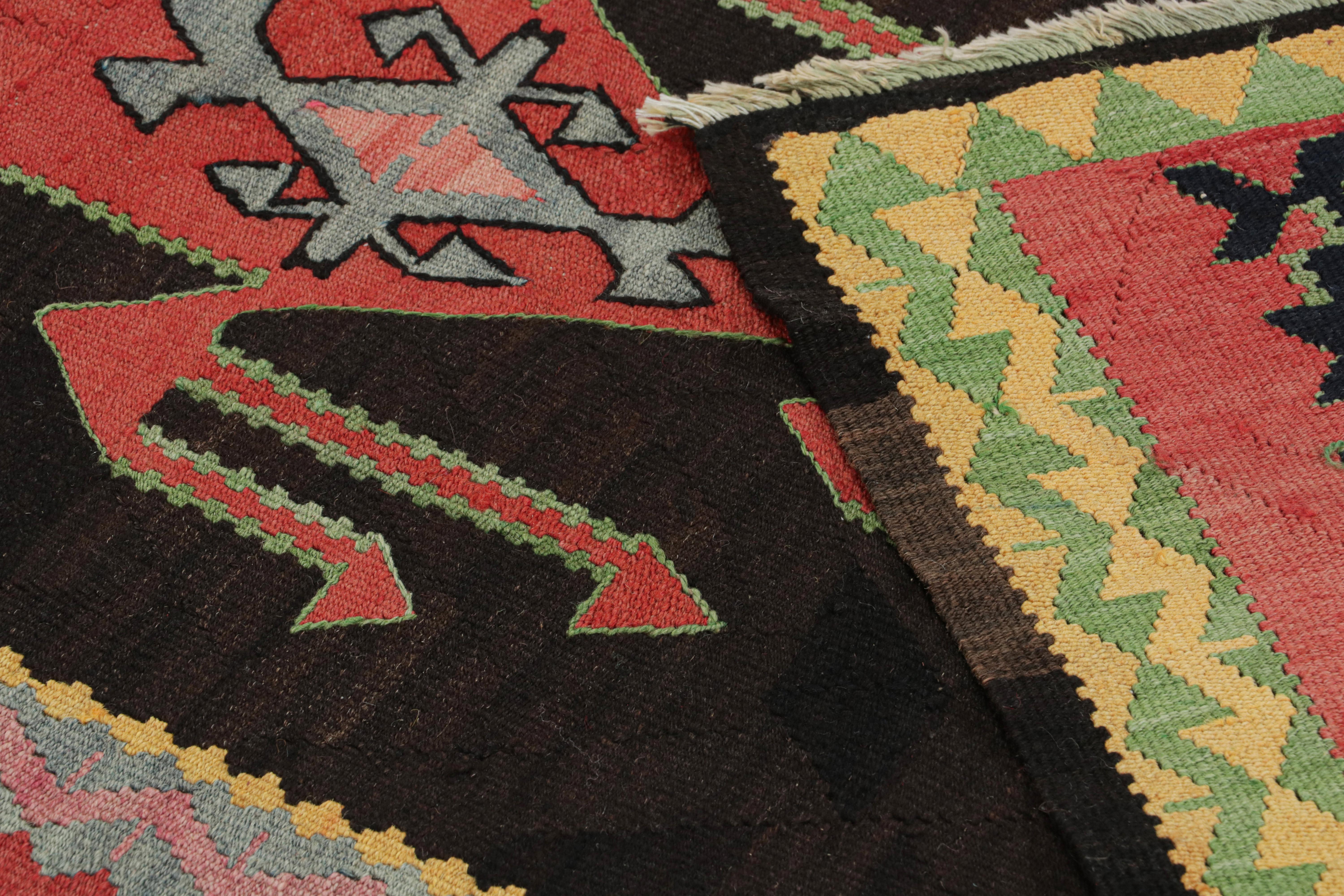 Mid-20th Century Vintage Persian Kilim with Red Patterns on a Black Field, from Rug & Kilim For Sale