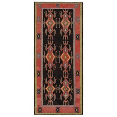 Kilim persiano vintage con motivi rossi su campo nero, da Rug & Kilim