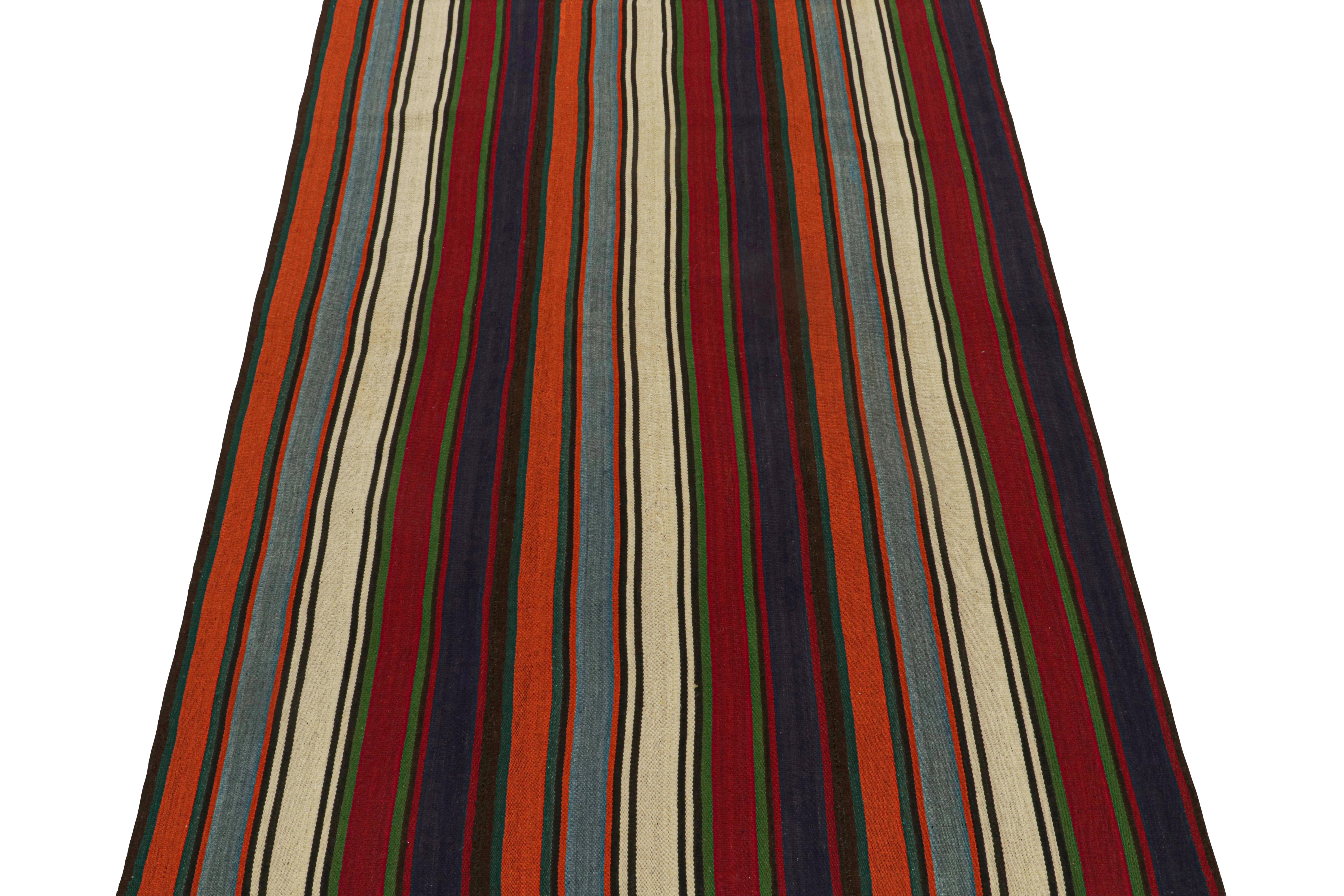 This vintage 5x8 Persian Kilim is a rare mid-century tribal rug, handwoven in wool circa 1950-1960. 

Its design most likely represents a Jajim-style Kilim–a flat-weaving technique in which multiple pieces are combined into one. This creates the