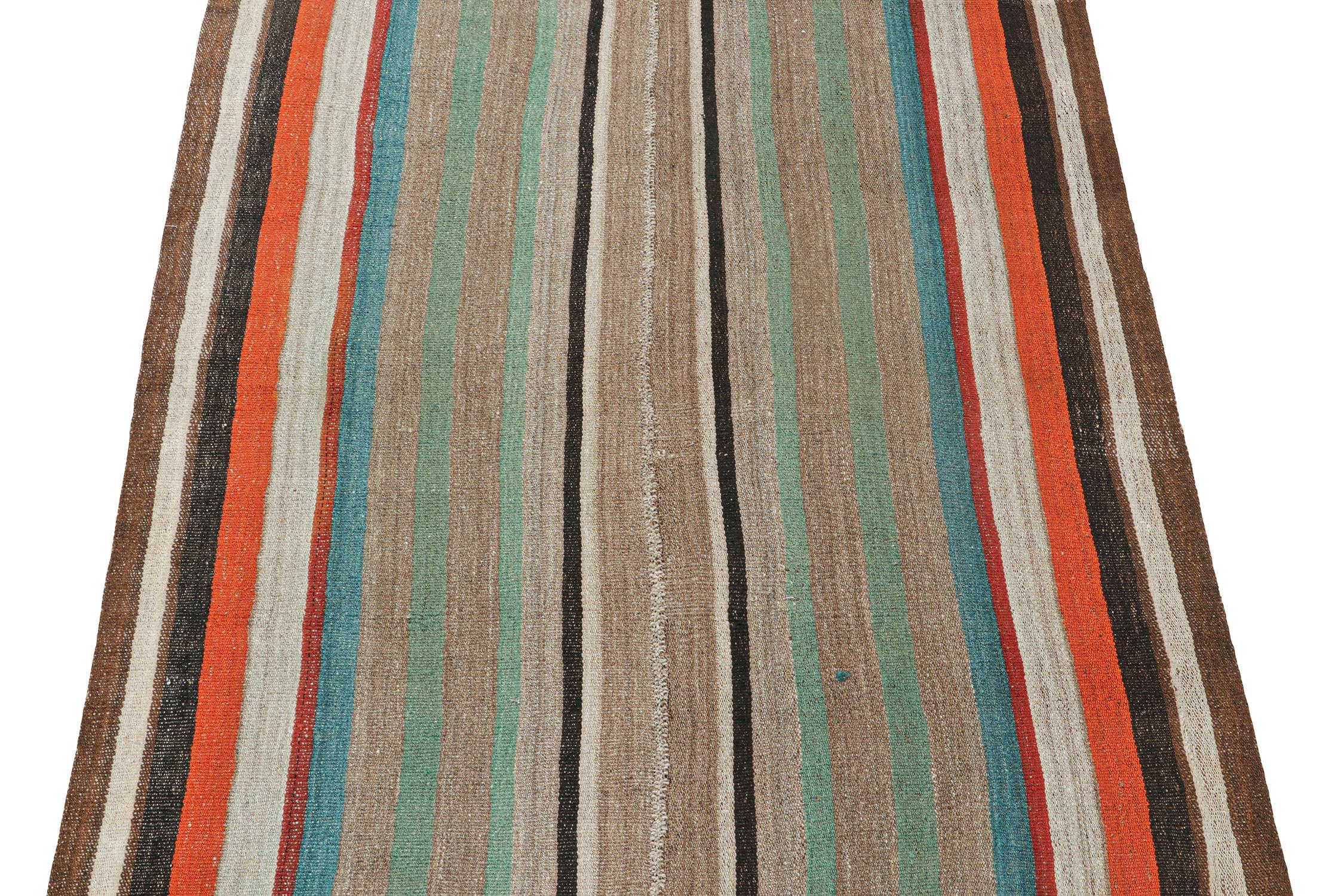 This vintage 6x7 Persian Kilim is a rare midcentury tribal rug, handwoven in wool circa 1950-1960. 

Its design most likely represents a Jajim-style Kilim–a flat-weaving technique in which multiple pieces are combined into one. This creates the