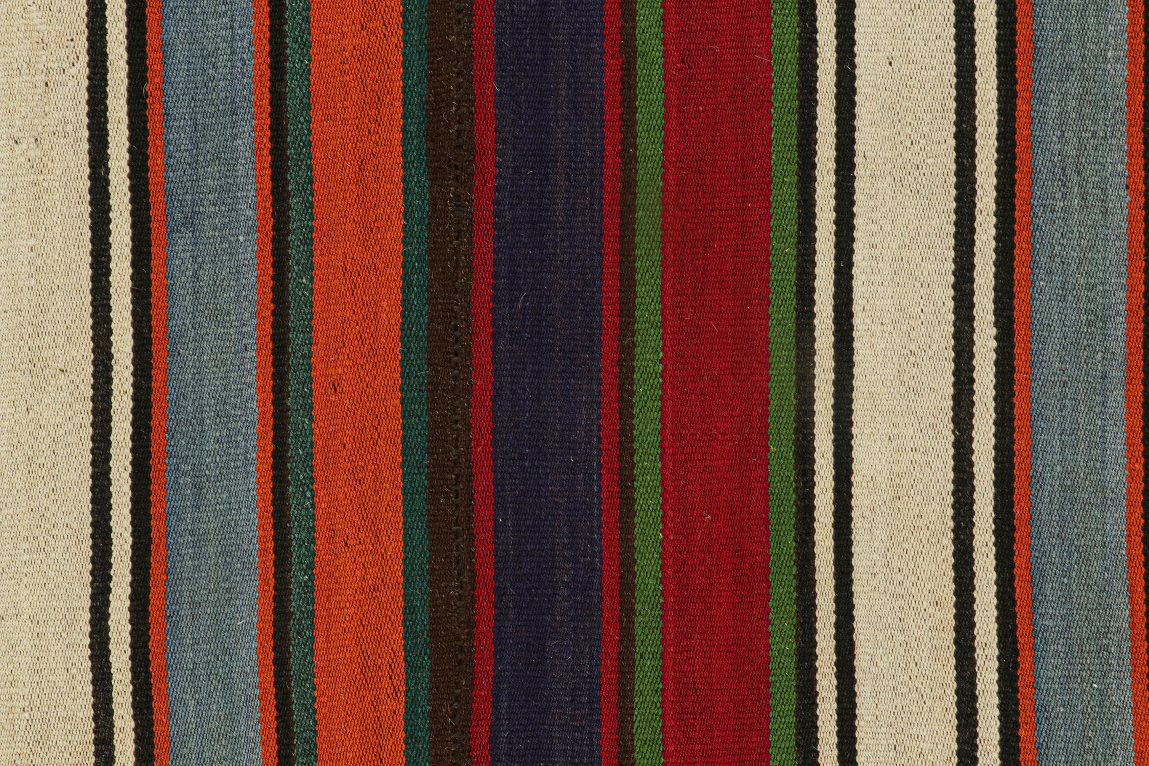 Mid-20th Century Vintage Persian Kilim with Vibrant Polychromatic Stripes by Rug & Kilim For Sale