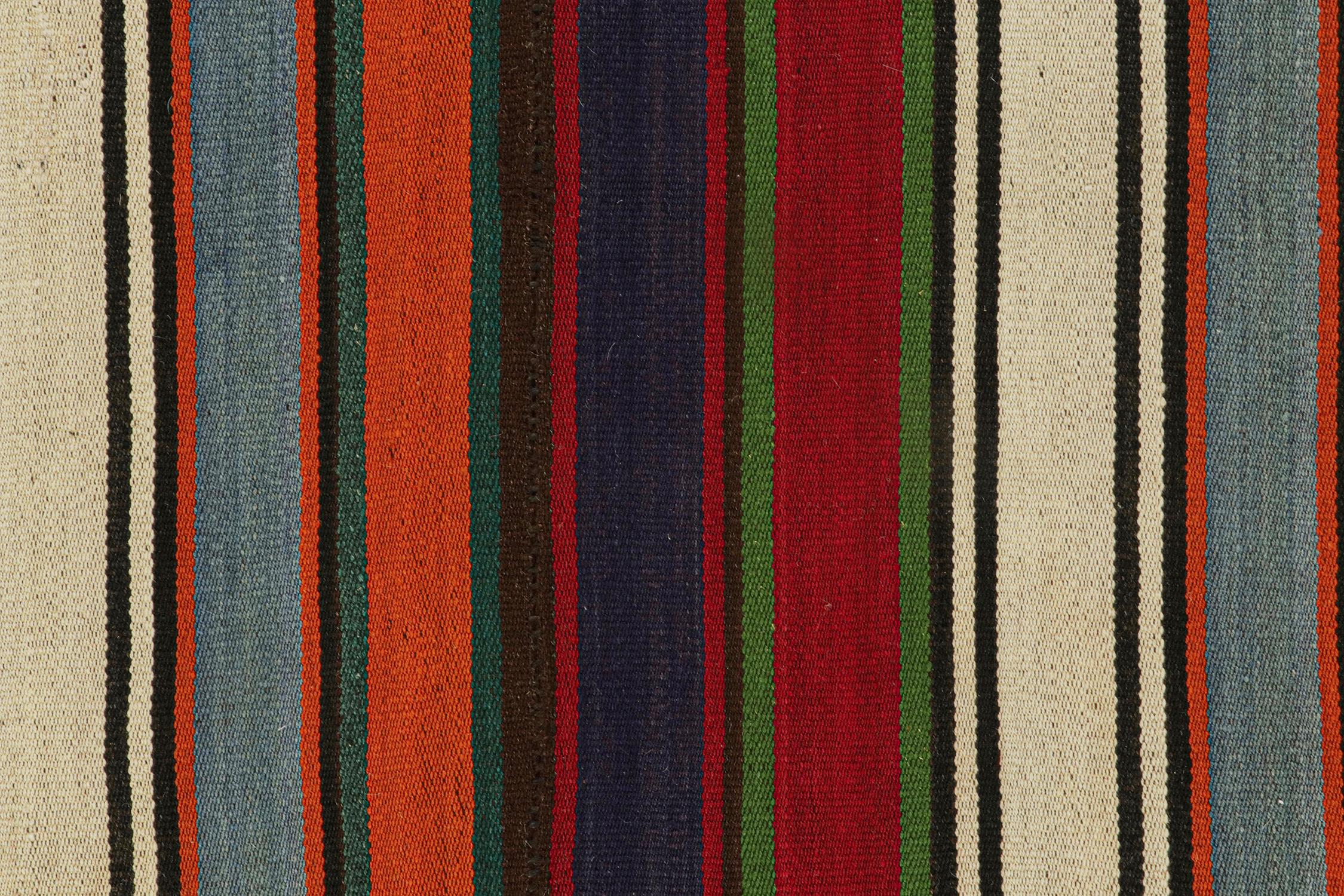 Mid-20th Century Vintage Persian Kilim with Vibrant Polychromatic Stripes by Rug & Kilim For Sale