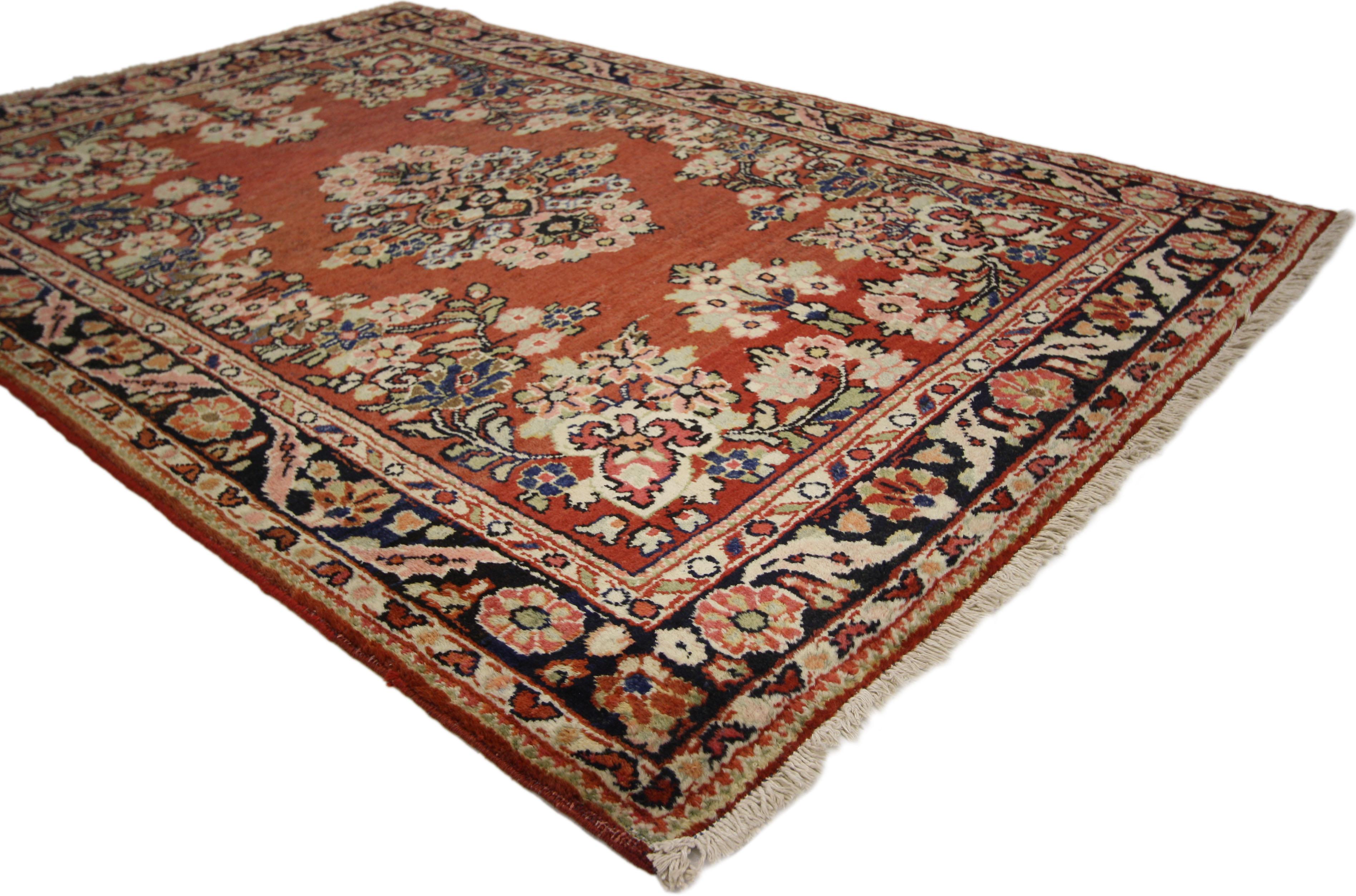 74582 Vintage Persian Mahal Rug with Rustic English Country Cottage Style 04'07 x 06'06. Boasting a floral bounty in a range of warm hues, this vintage Persian Mahal rug is a delightful example of English Country Cottage style. At the center of the