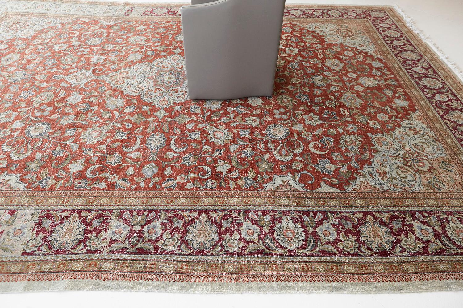 Featuring a myriad of symbolic ancient motifs in the gorgeous warm colour scheme running along the abrashed field. This fascinating rug exhibits the celebration of dance and composition reflected by the botanical elements of this stunning Vintage